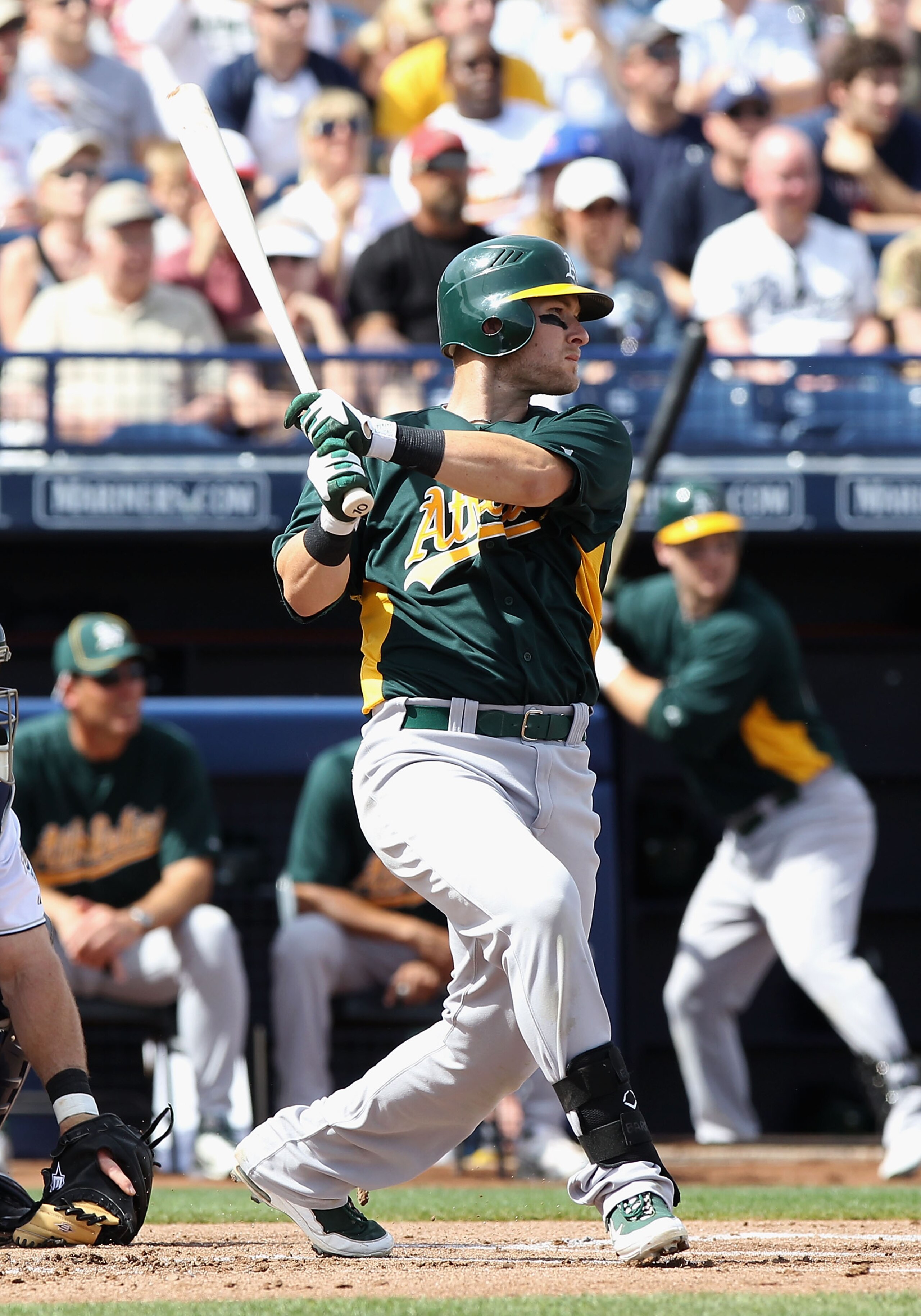 PEORIA, AZ - MARCH 06:  Daric Barton #10 of the Oakland Athletics hits a single against the San Diego Padres during the first inning of the spring training game at Peoria Stadium on March 6, 2011 in Peoria, Arizona.  (Photo by Christian Petersen/Getty Ima