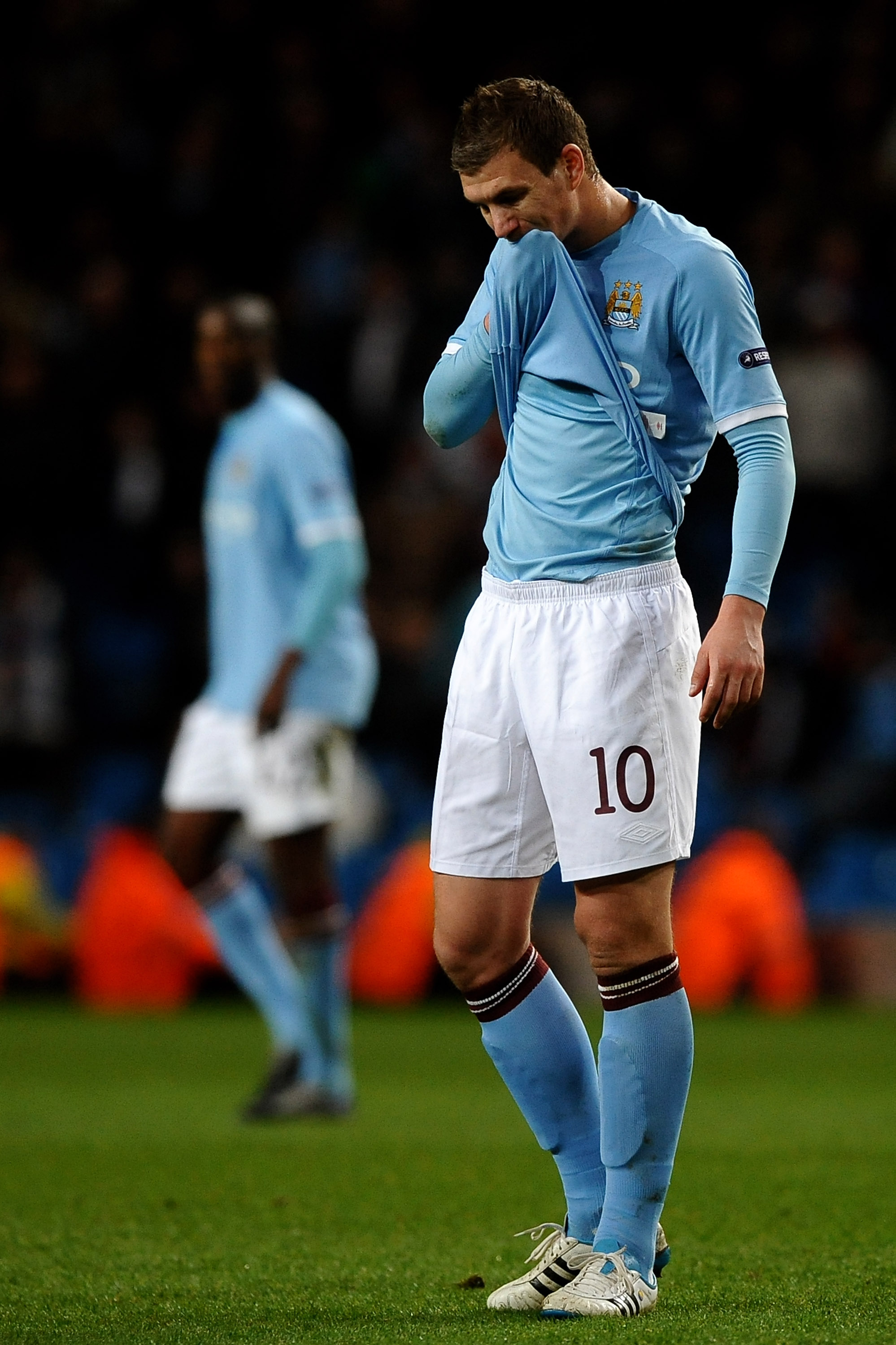 MANCHESTER, ENGLAND - MARCH 17: Edin Dzeko of Manchester City shows his dejection during the UEFA Europa League round of 16 second leg match between Manchester City and Dynamo Kiev at City of Manchester Stadium on March 17, 2011 in Manchester, England.  (