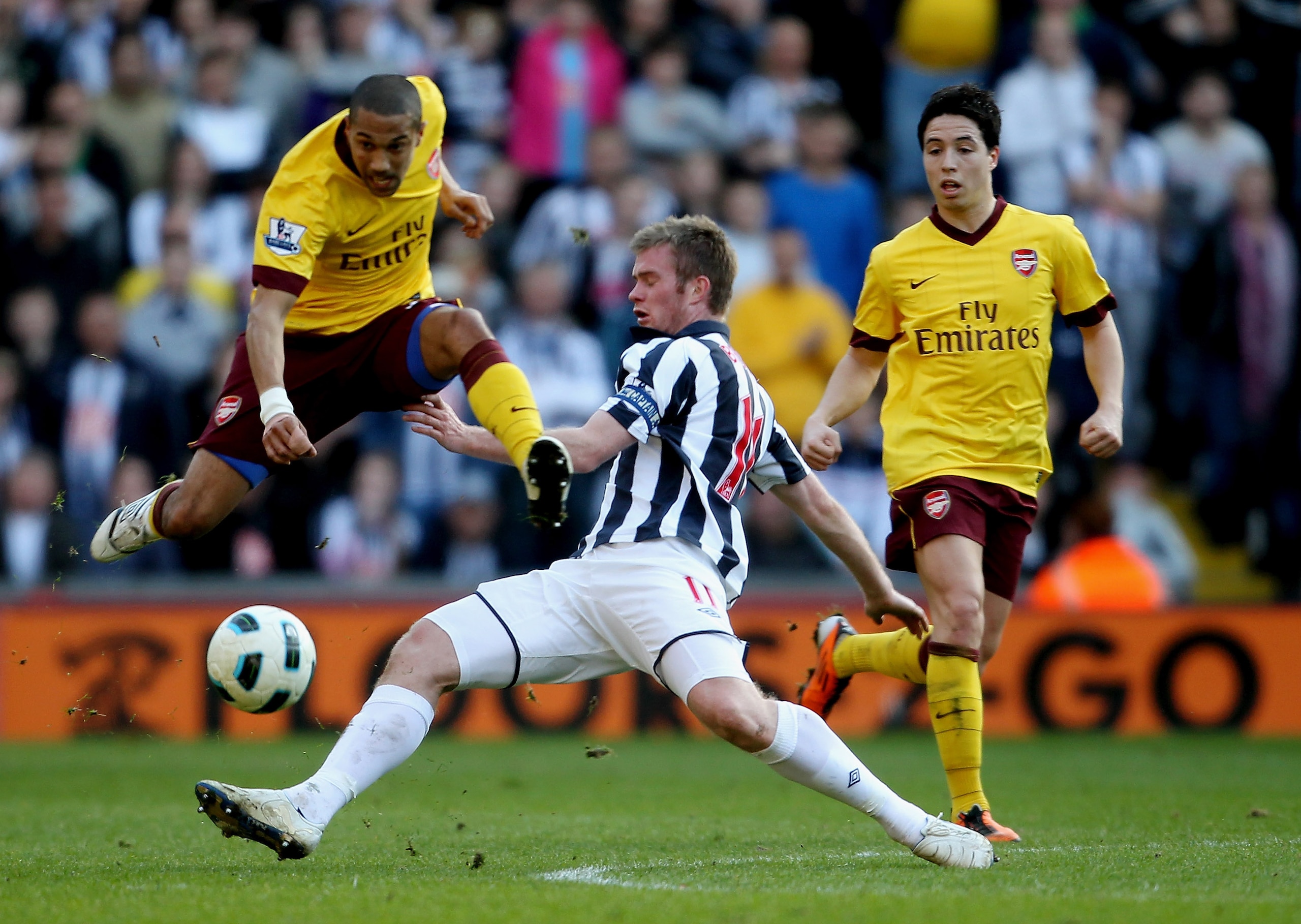 WEST BROMWICH, ENGLAND - MARCH 19:  Chris Brunt of WBA (C) in action with Samir Nasri (R)and Gael CLichy (L) of Arsenal during the Barclays Premier League match between West Bromwich Albion and Arsenal at The Hawthorns on March 19, 2011 in West Bromwich, 