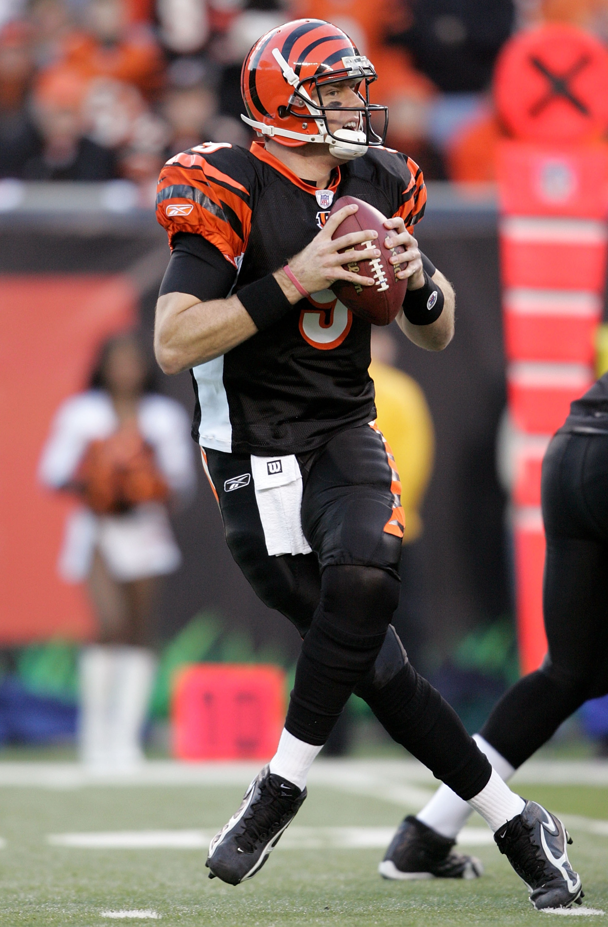CINCINNATI - JANUARY 08:  Quaterback Carson Palmer #9 of the Cincinnati Bengals drops back to pass on the second play of the AFC Wild Card Playoff Game against the Pittsburgh Steelers at Paul Brown Stadium on January 8, 2006 in Cincinnati, Ohio.  Palmer w