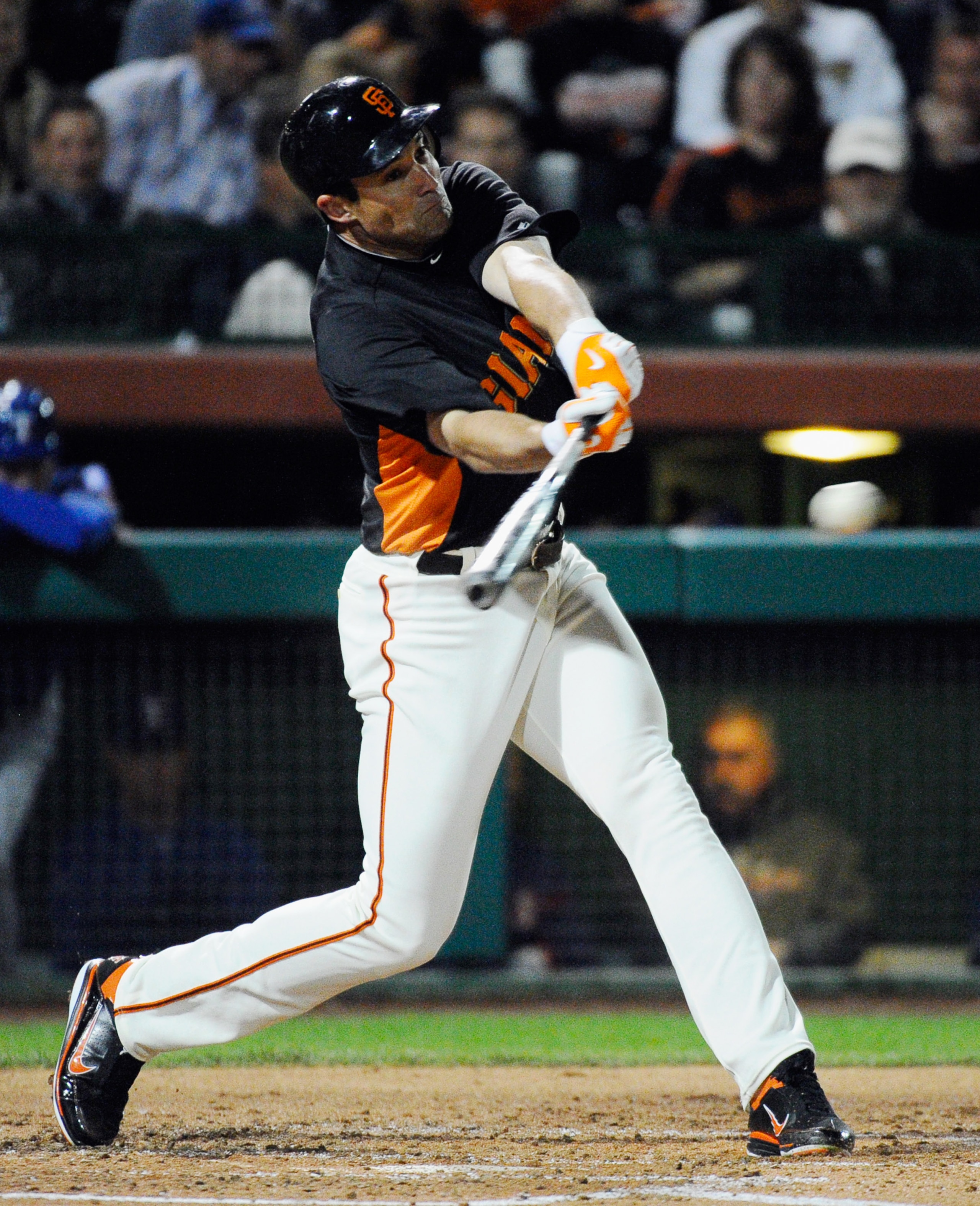 SCOTTSDALE, AZ - MARCH 07:  Pat Burrell #5 of the San Francisco Giants swings the bat during an exhibition baseball game against the Texas Rangers in the first meeting between the two teams since the World Series at Scottsdale Stadium on March 7, 2011 in