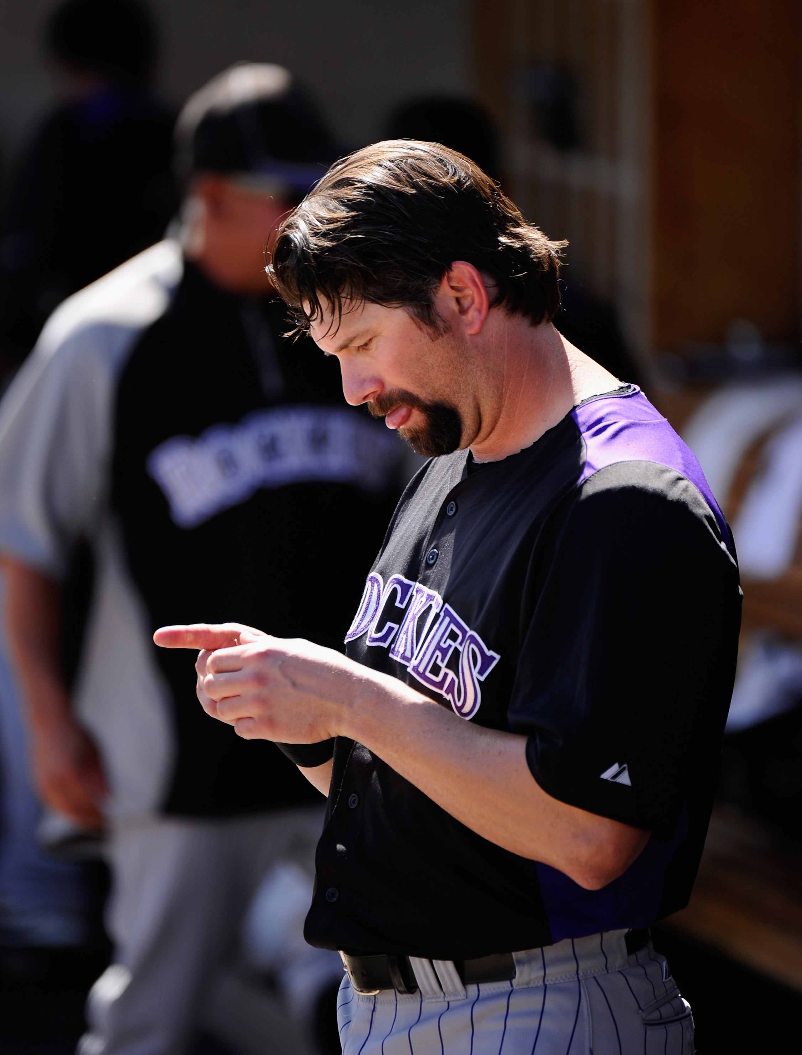 PHOENIX, AZ - MARCH 10:  Todd Helton #17 of the Colorado Rockies in the dugout against the Milwaukee Brewers during the spring training baseball game at Maryvale Baseball Park on March 10, 2011 in Phoenix, Arizona.  (Photo by Kevork Djansezian/Getty Image