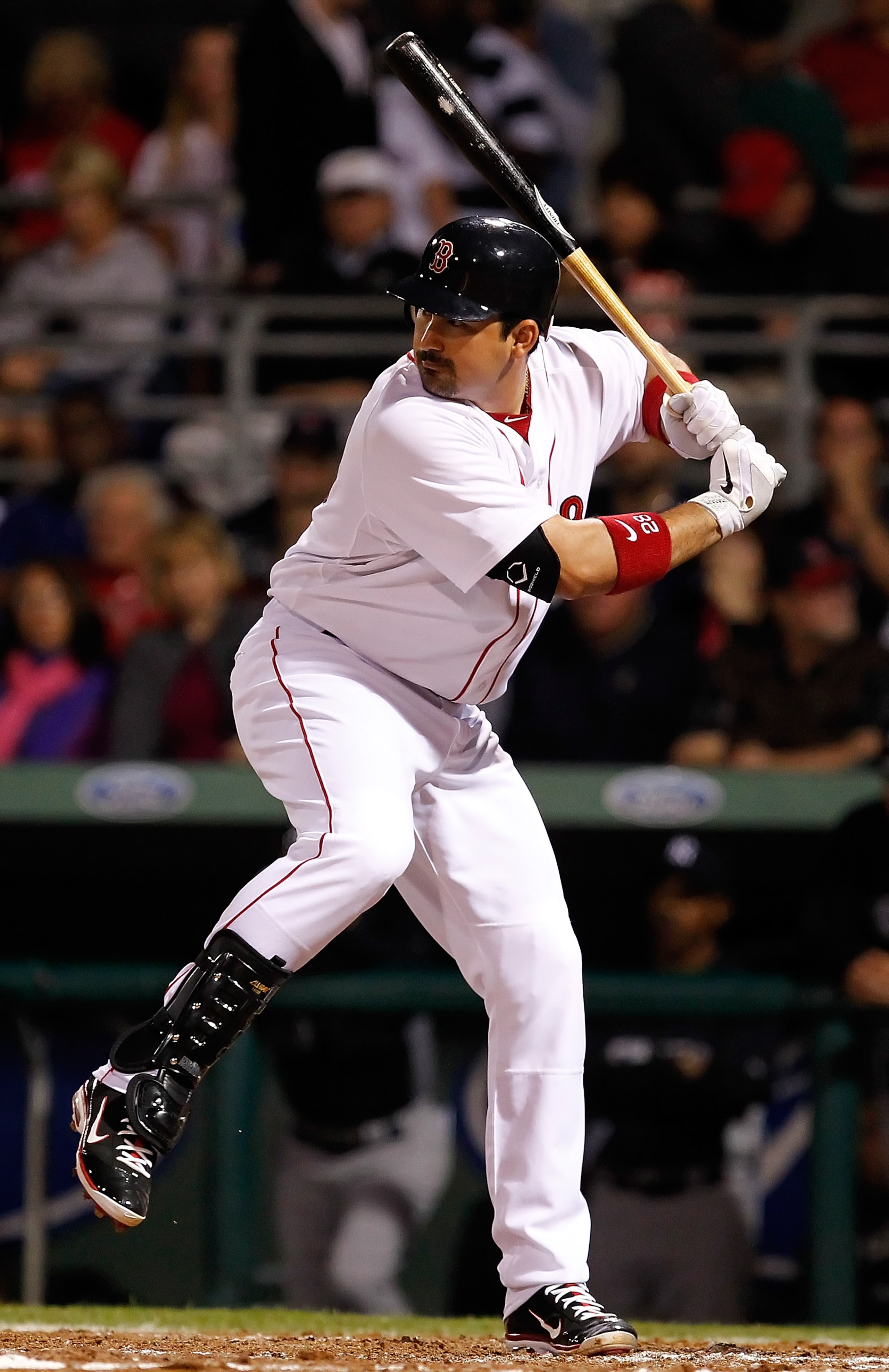 FORT MYERS, FL - MARCH 14:  Infielder Adrian Gonzalez #28 of the Boston Red Sox bats against the New York Yankees during a Grapefruit League Spring Training Game at City of Palms Park on March 14, 2011 in Fort Myers, Florida.  (Photo by J. Meric/Getty Ima
