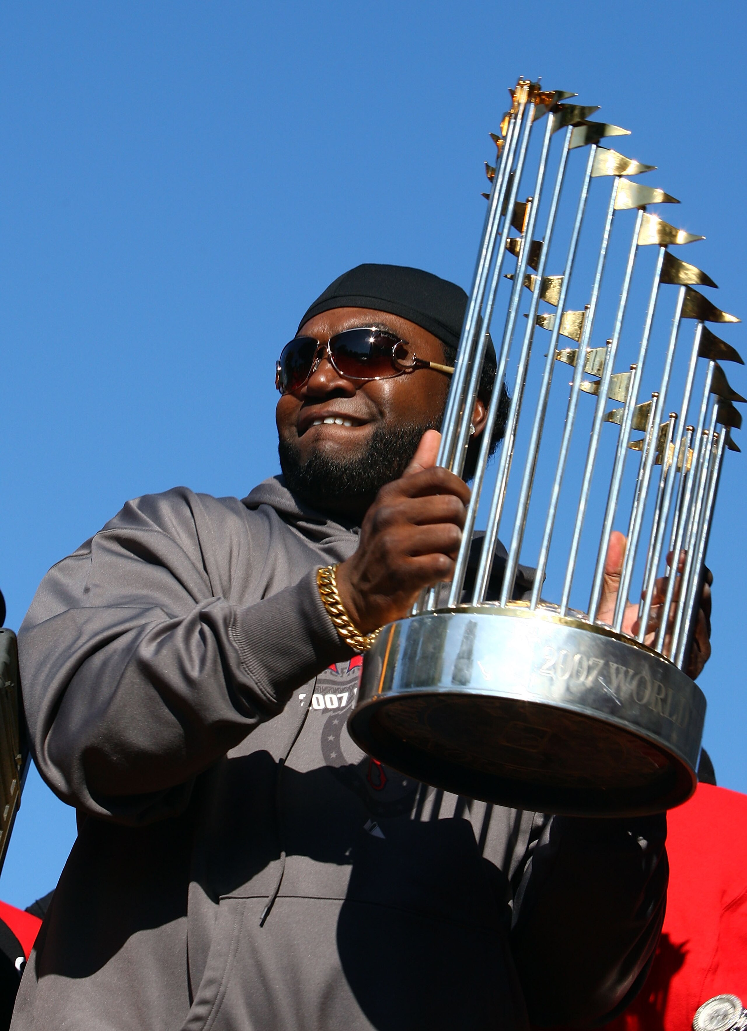 BOSTON - OCTOBER 30:  David Ortiz #34 of the Boston Red Sox holds the World Series Trophy during the Boston Red Sox World Series Victory Celebration on October 30, 2007 in Boston, Massachusetts  (Photo by Elsa/Getty Images)