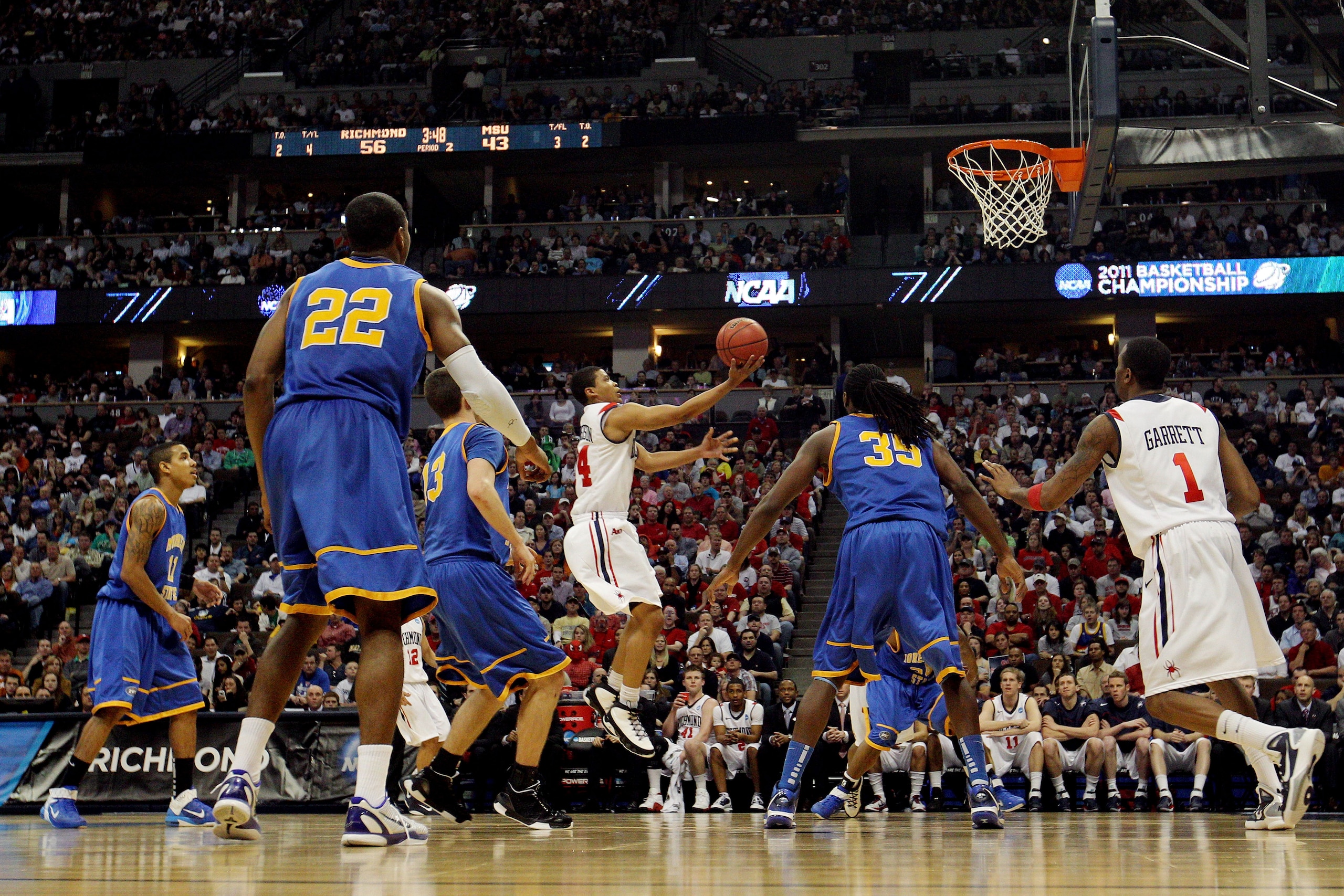 DENVER, CO - MARCH 19:  Kevin Anderson #14 of the Richmond Spiders goes to the basket against the Morehead State Eagles during the third round of the 2011 NCAA men's basketball tournament at Pepsi Center on March 19, 2011 in Denver, Colorado.  (Photo by J