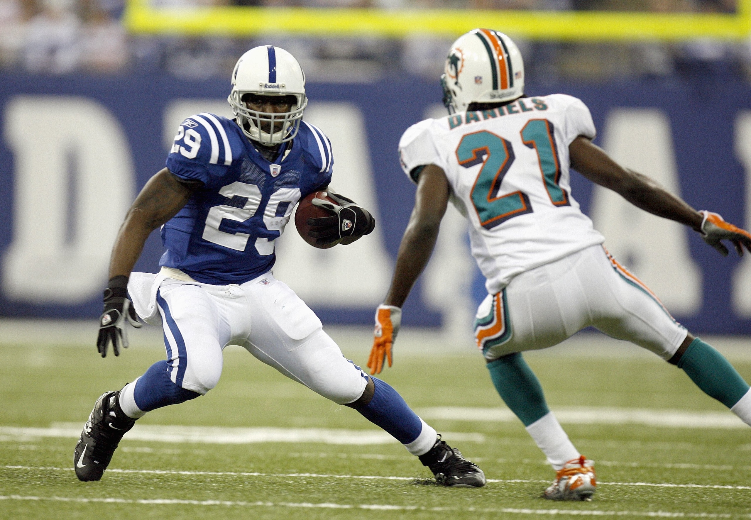 INDIANAPOLIS - DECEMBER 31: Joseph Addai #29 of the Indianapolis Colts carries the ball against Travis Daniels #21 of the Miami Dolphins at the RCA Dome on December 31, 2006 in Indianapolis, Indiana. Indianapolis won the game 27-22. (Photo by Gregory Sham