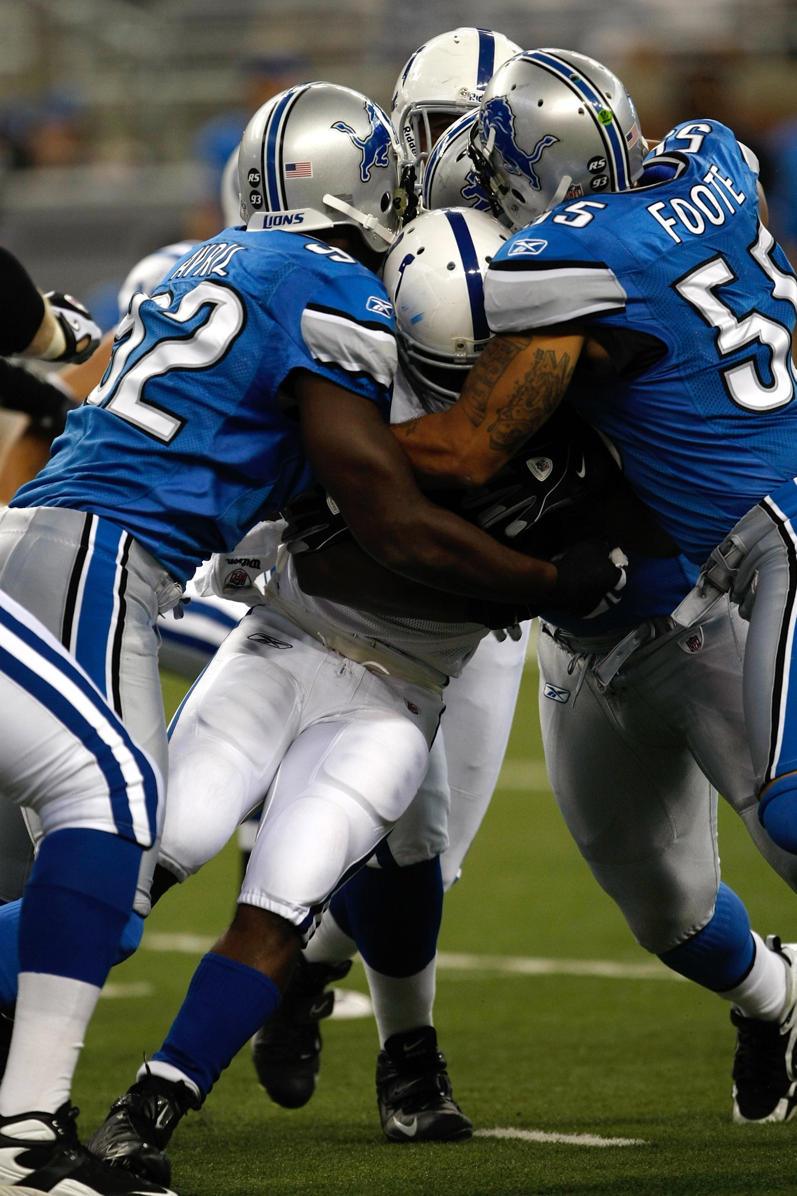 DETROIT, MI - AUGUST 28: Running back Joseph Addai #29 of the Indianapolis Colts is tackled by several defenders against the Detroit Lions at Ford Field on August 28, 2009 in Detroit, Michigan.  (Photo by Scott Boehm/Getty Images)