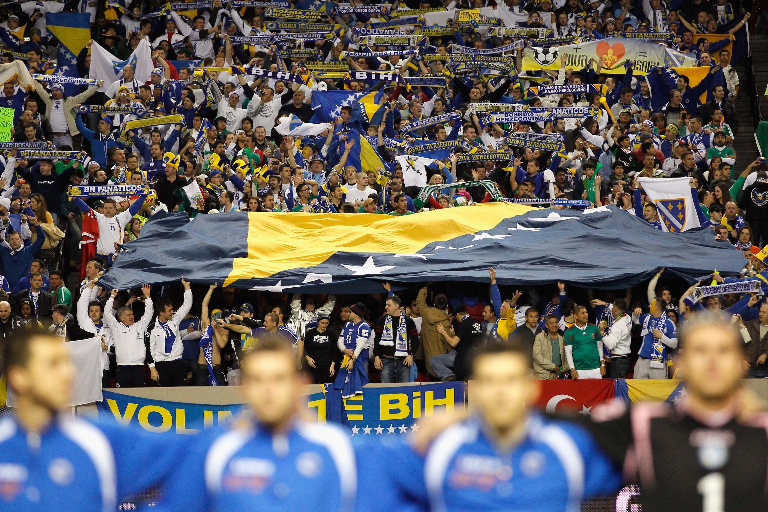 ATLANTA, GA - FEBRUARY 09:  Fans of Bosnia-Herzegovina hold up a large flag during their anthem before facing Mexico during an international friendly match at Georgia Dome on February 9, 2011 in Atlanta, Georgia.  (Photo by Kevin C. Cox/Getty Images)
