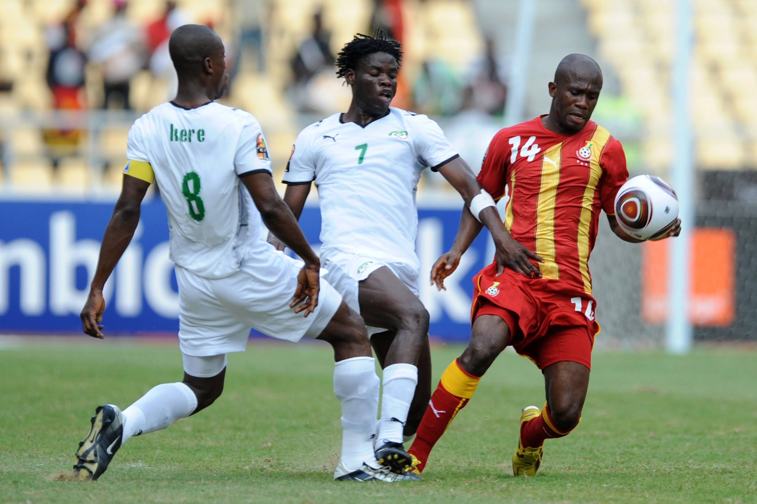ANGOLA, LUANDA - JANUARY 19: Mahamoudou Kere, Florent Rouamba of Burkina Faso challenge Matthew Amoah of Ghana  during the Africa Cup of Nations match between Burkina Fuso and Ghana at the November 11 (Cidadela) Stadium on January 19, 2010 in Luanda, Ango