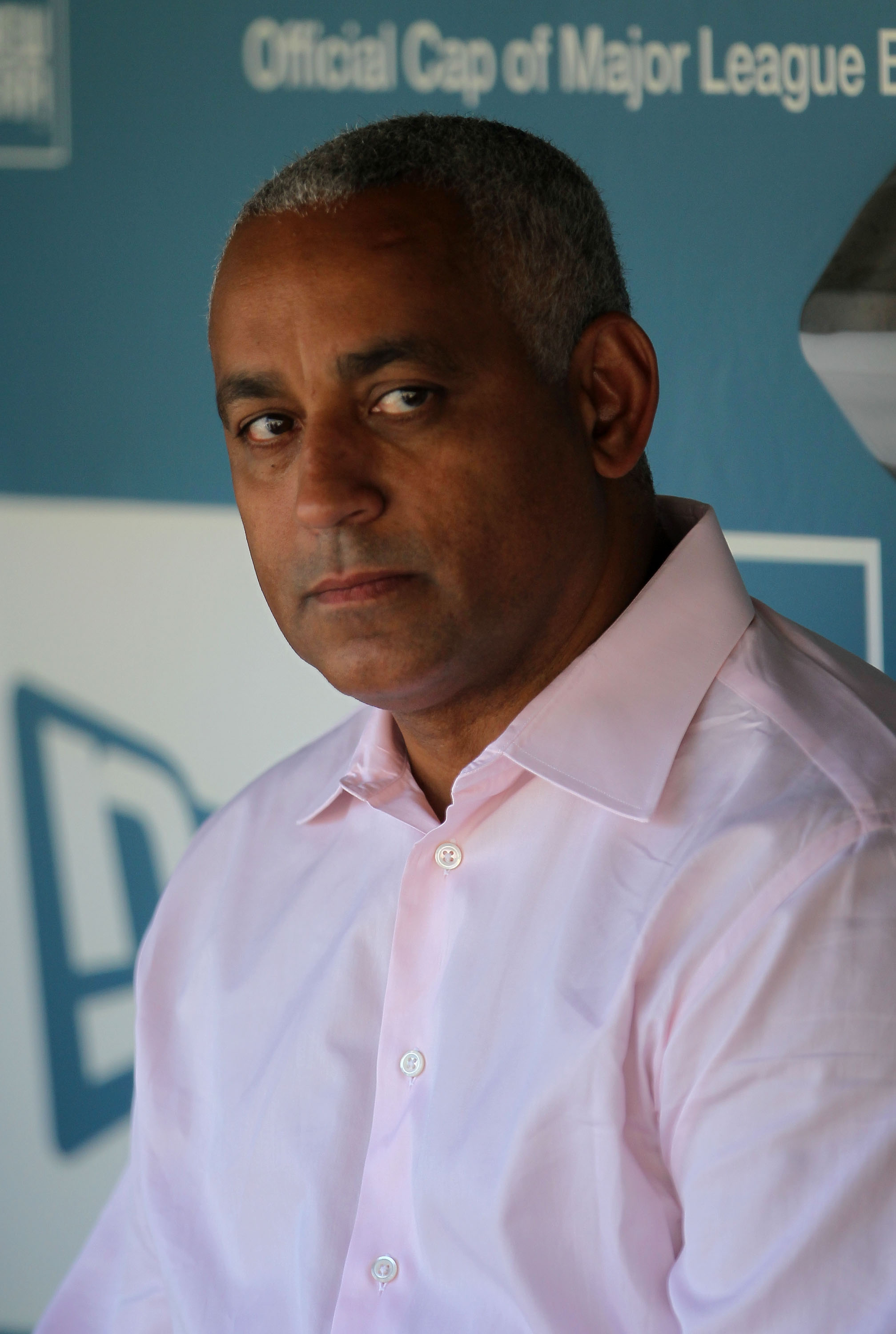 LOS ANGELES, CA - JULY 24:  New York Mets general manager Omar Minaya looks on from the dugout prior to the start of the game against the Los Angeles Dodgers at Dodger Stadium on July 24, 2010 in Los Angeles, California.  (Photo by Jeff Gross/Getty Images