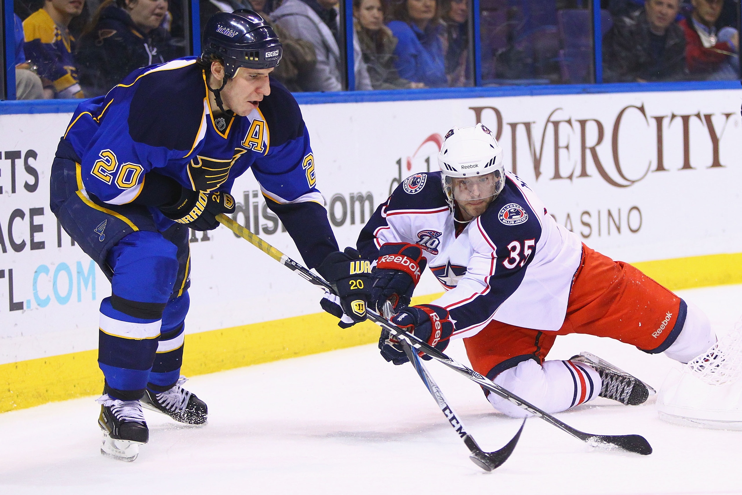 ST. LOUIS, MO - MARCH 7: Alexander Steen #20 of the St. Louis Blues and Jan Hejda #35 of the Columbus Blue Jackets fight for control of the puck at the Scottrade Center on March 7, 2011 in St. Louis, Missouri.  The Blues beat the Bluejackets 5-4 in a shoo