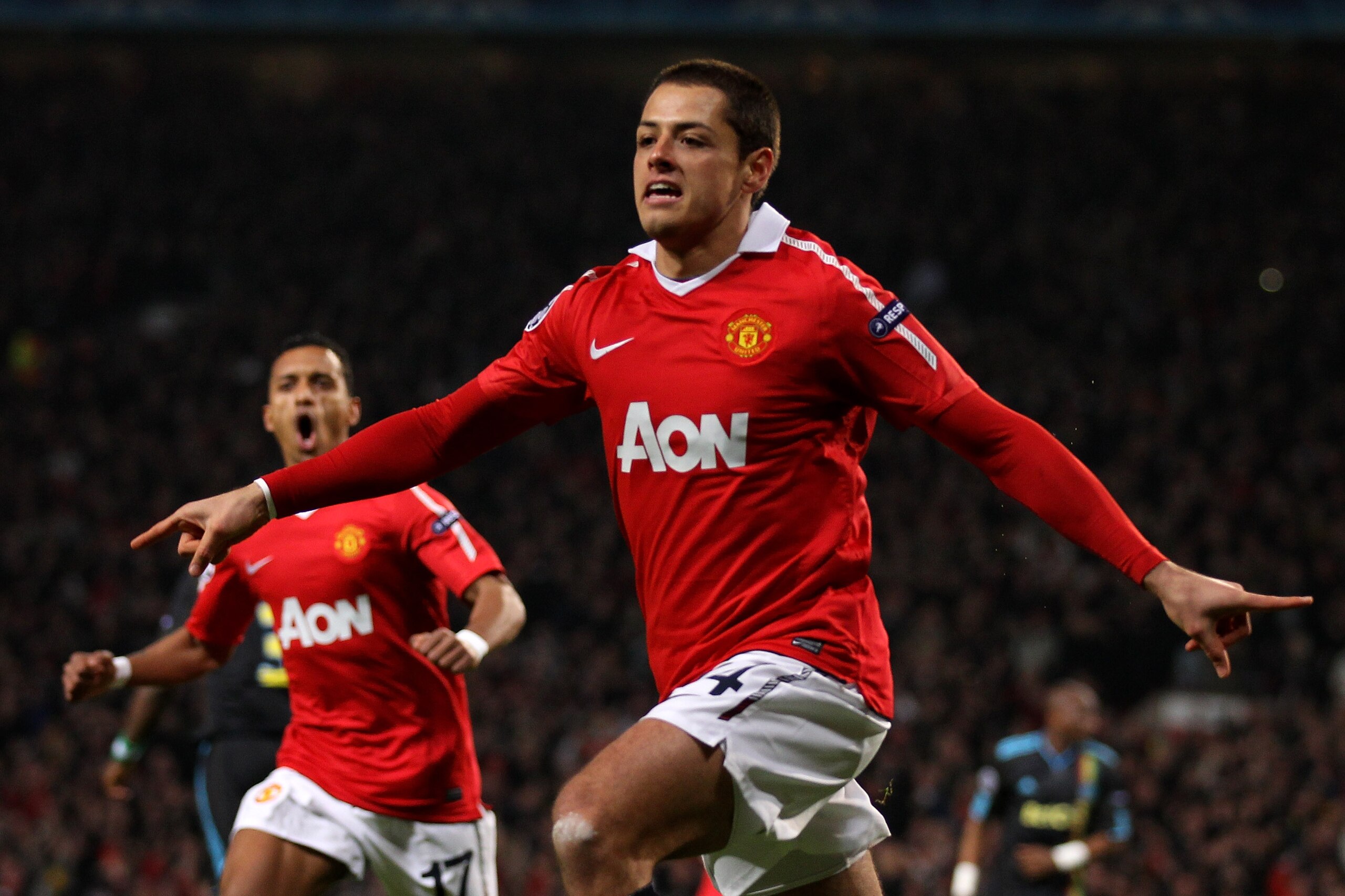 MANCHESTER, ENGLAND - MARCH 15:  Javier Hernandez of Manchester United celebrates scoring the opening goal during the UEFA Champions League round of 16 second leg match between Manchester United and Marseille at Old Trafford on March 15, 2011 in Mancheste