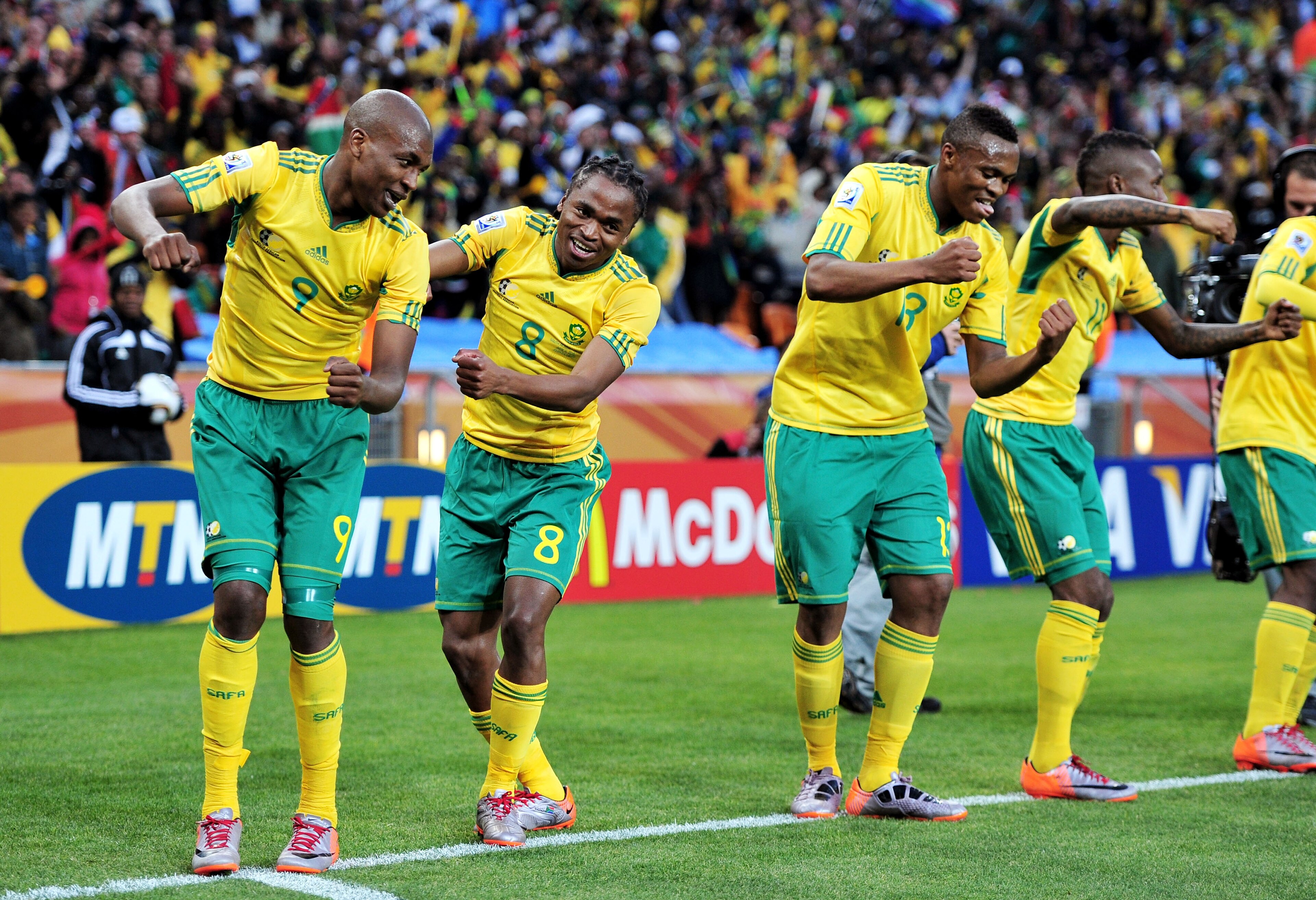 JOHANNESBURG, SOUTH AFRICA - JUNE 11: Siphiwe Tshabalala (C) of South Africa celebrates scoring the first goal with team mates during the 2010 FIFA World Cup South Africa Group A match between South Africa and Mexico at Soccer City Stadium on June 11, 20 JOHANNESBURG, SOUTH AFRICA - JUNE 11: Siphiwe Tshabalala (C) of South Africa celebrates scoring the first goal with team mates during the 2010 FIFA World Cup South Africa Group A match between South Africa and Mexico at Soccer City Stadium on June 11, 20