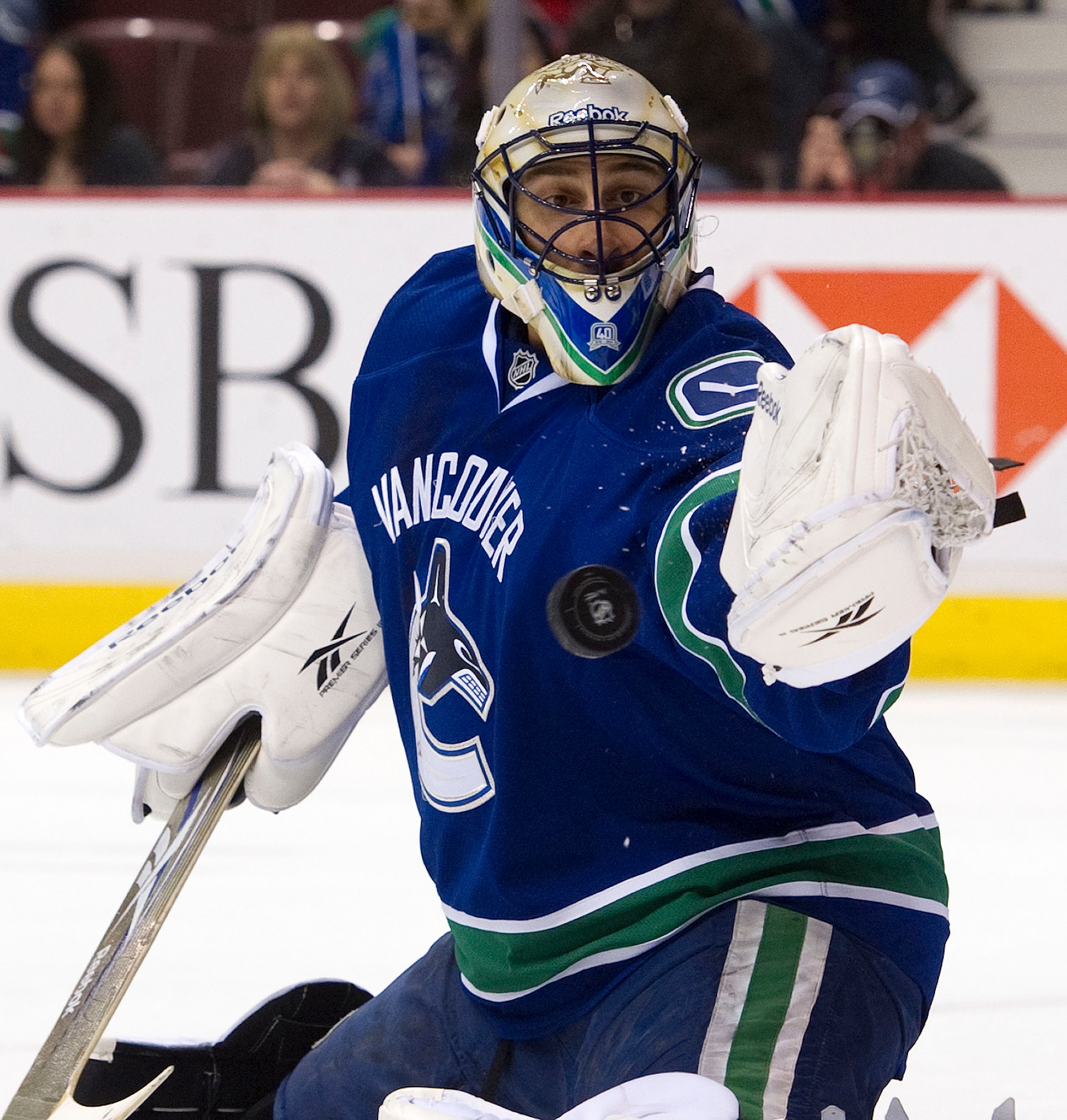 VANCOUVER, CANADA - MARCH 3: Goalie Roberto Luongo #1 of the Vancouver Canucks makes a glove save against the Nashville Predators during the first period in NHL action on March 03, 2011 at Rogers Arena in Vancouver, British Columbia, Canada.  (Photo by Ri