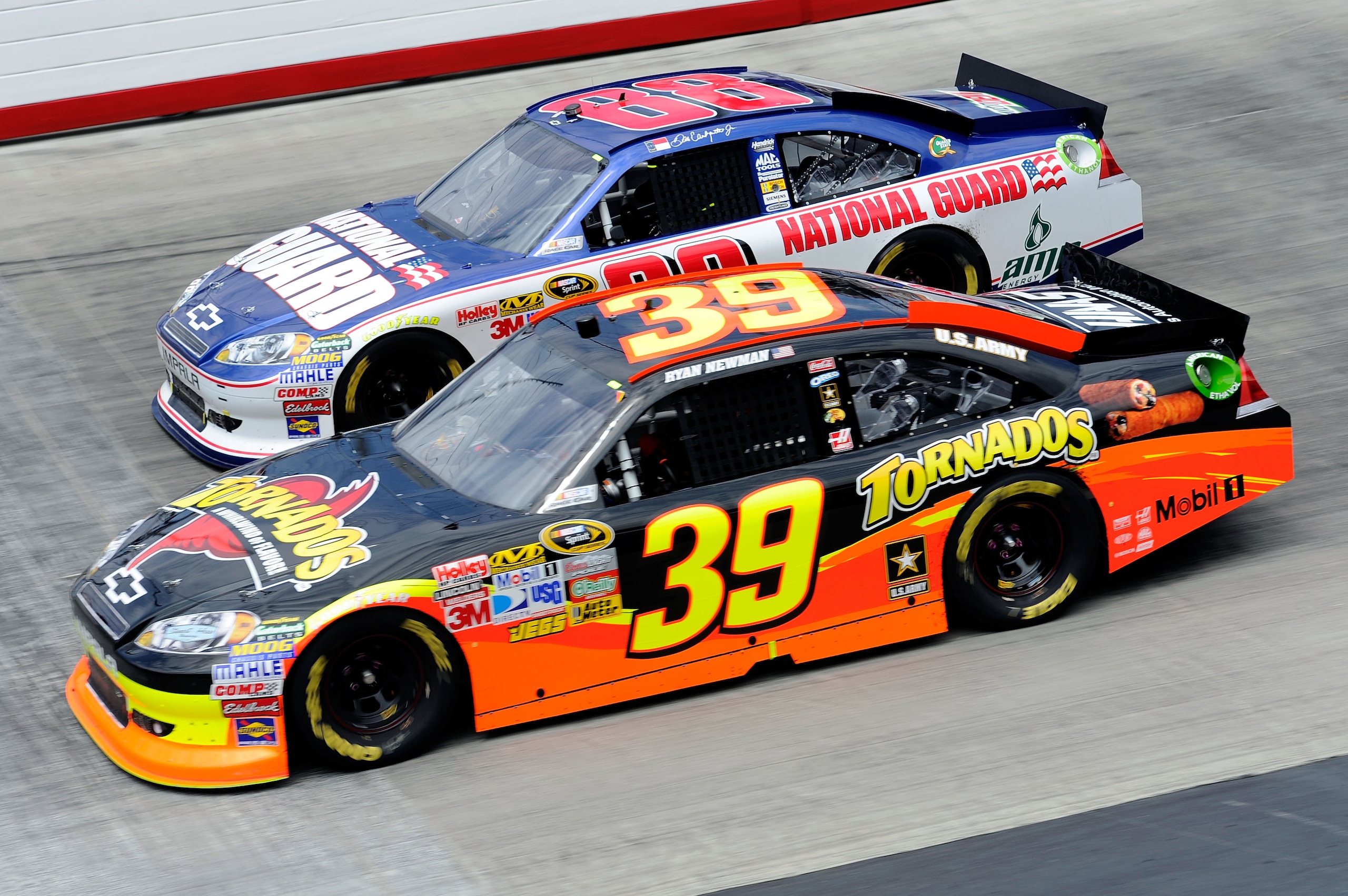 BRISTOL, TN - MARCH 20:  Ryan Newman, driver of the #39 Tornados Chevrolet, races Dale Earnhardt Jr., driver of the #88 National Guard/Amp Energy Chevrolet, during the NASCAR Sprint Cup Series Jeff Byrd 500 Presented By Food City at Bristol Motor Speedway
