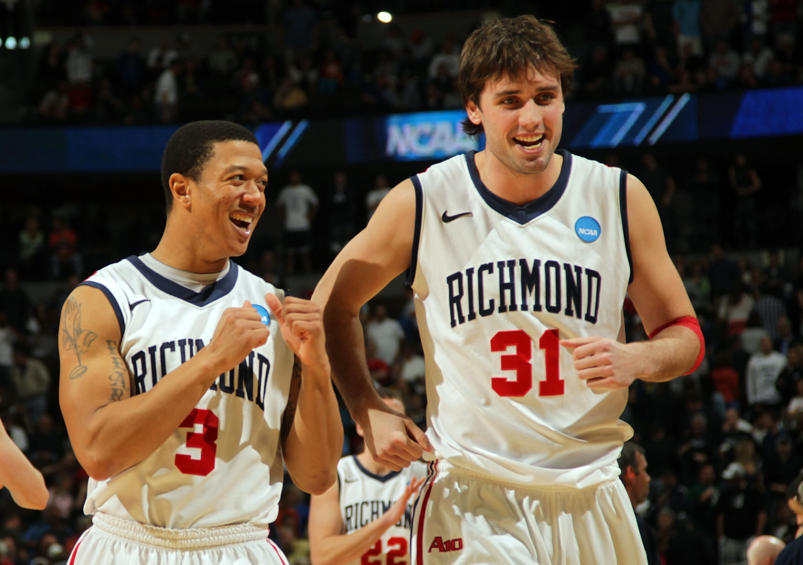 DENVER, CO - MARCH 19:  Darien Brothers #3 and Conor Smith #31 of the Richmond Spiders celebrate after defeating the Morehead State Eagles during the third round of the 2011 NCAA men's basketball tournament at Pepsi Center on March 19, 2011 in Denver, Col