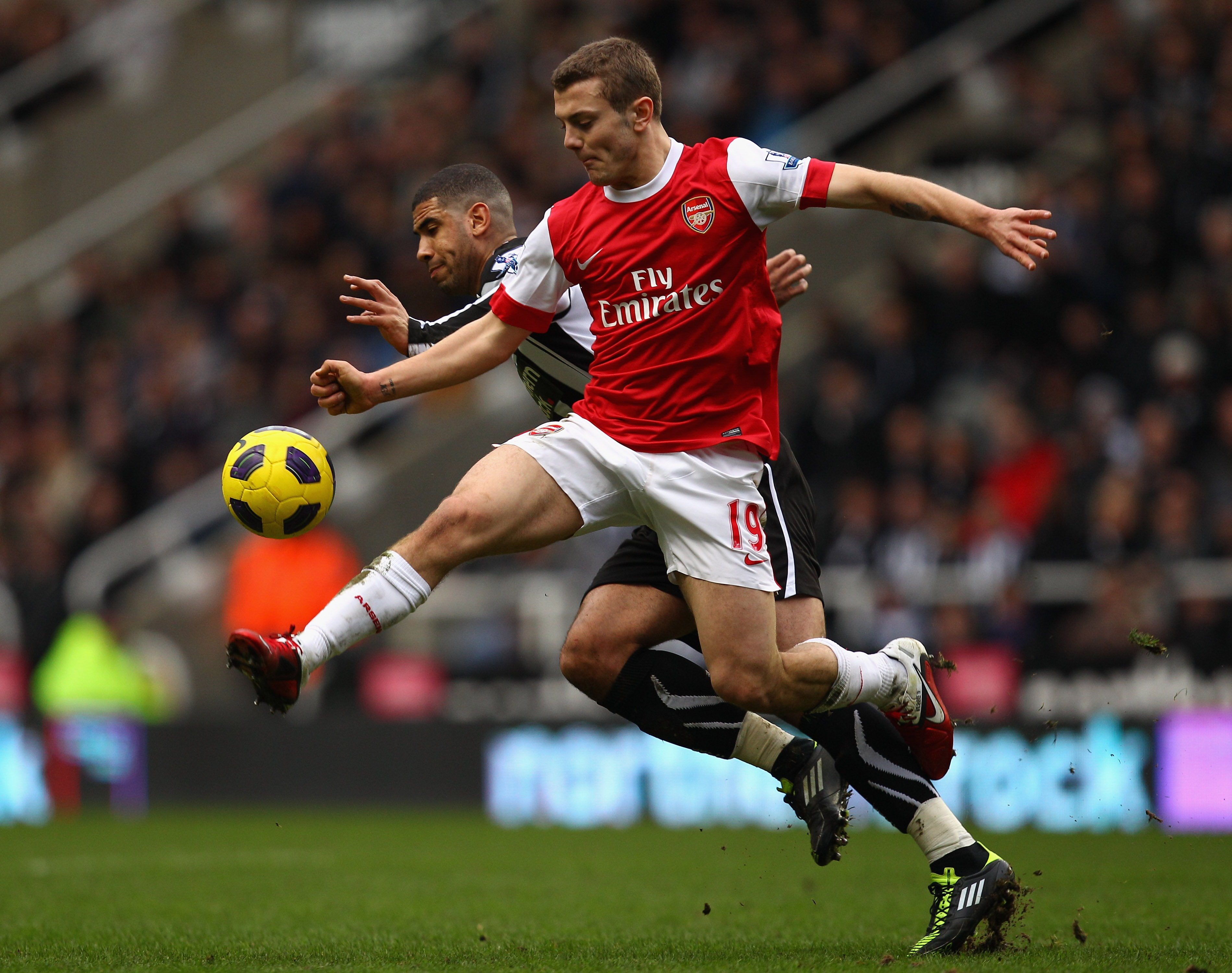 NEWCASTLE UPON TYNE, ENGLAND - FEBRUARY 05:  Jack Wilshire of Arsenal battles with Leon Best of Newcastle during the Barclays Premier League match between Newcastle United and Arsenal at St James' Park on February 5, 2011 in Newcastle upon Tyne, England.