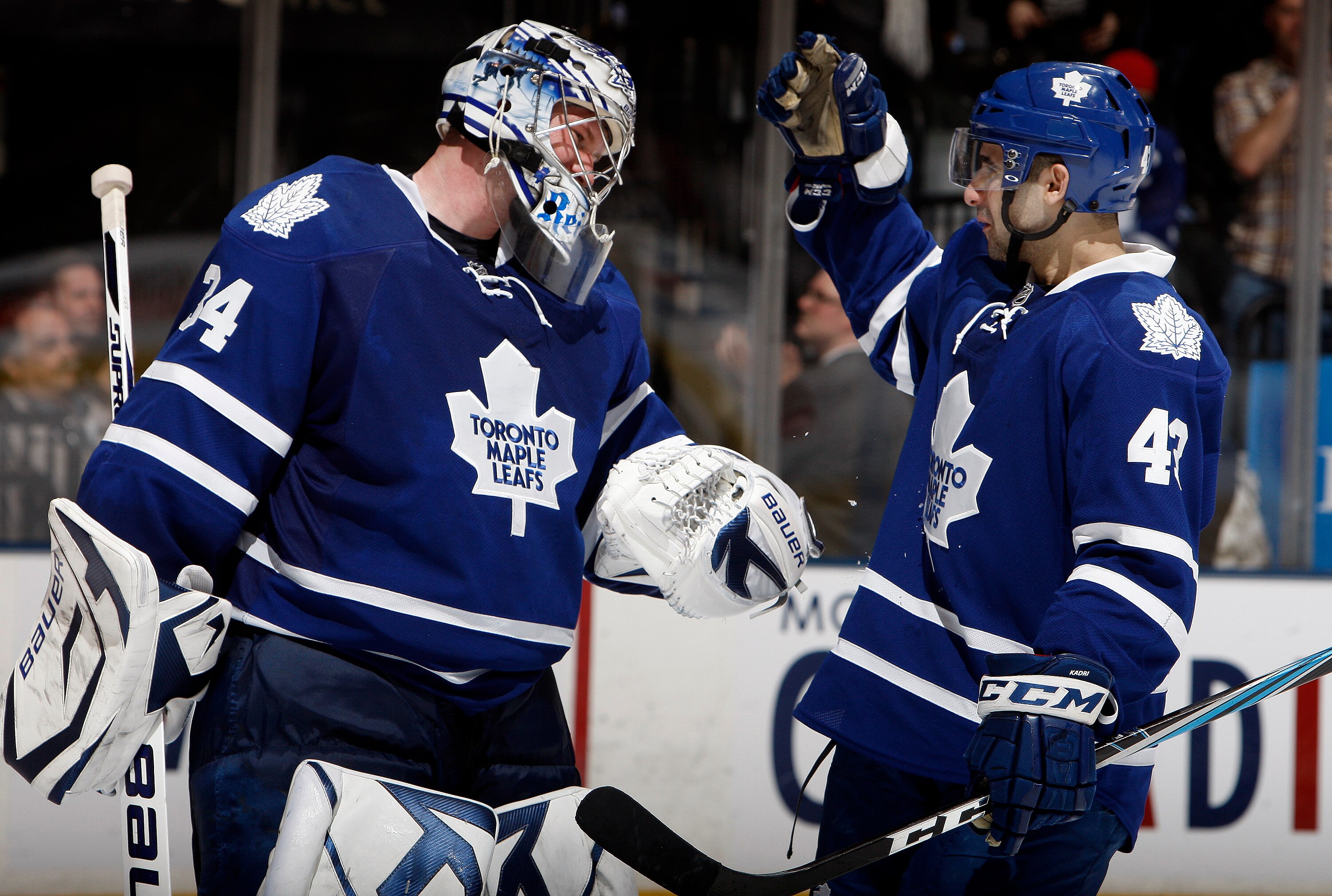 TORONTO, CANADA - MARCH 19  James Reimer #34 and Nazem Kadri #43 of the Toronto Maple Leafs celebrate 5-2 win over the Boston Bruins during game action at the Air Canada Centre March 19, 2011 in Toronto, Ontario, Canada. (Photo by Abelimages/Getty Images)