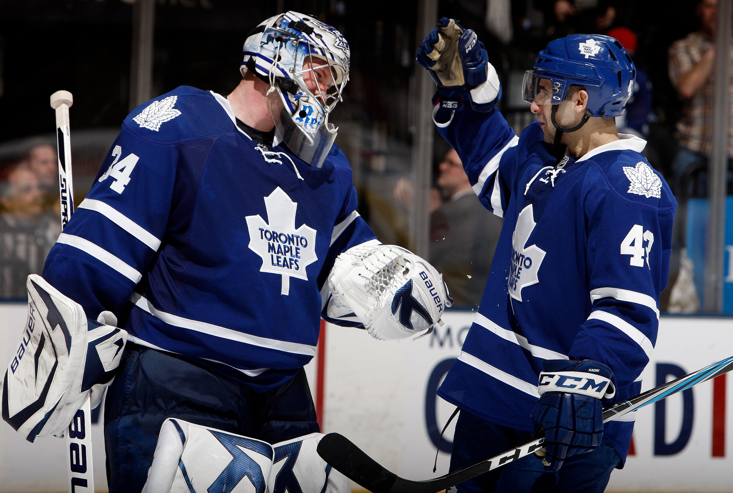TORONTO, CANADA - MARCH 19  James Reimer #34 and Nazem Kadri #43 of the Toronto Maple Leafs celebrate 5-2 win over the Boston Bruins during game action at the Air Canada Centre March 19, 2011 in Toronto, Ontario, Canada. (Photo by Abelimages/Getty Images)