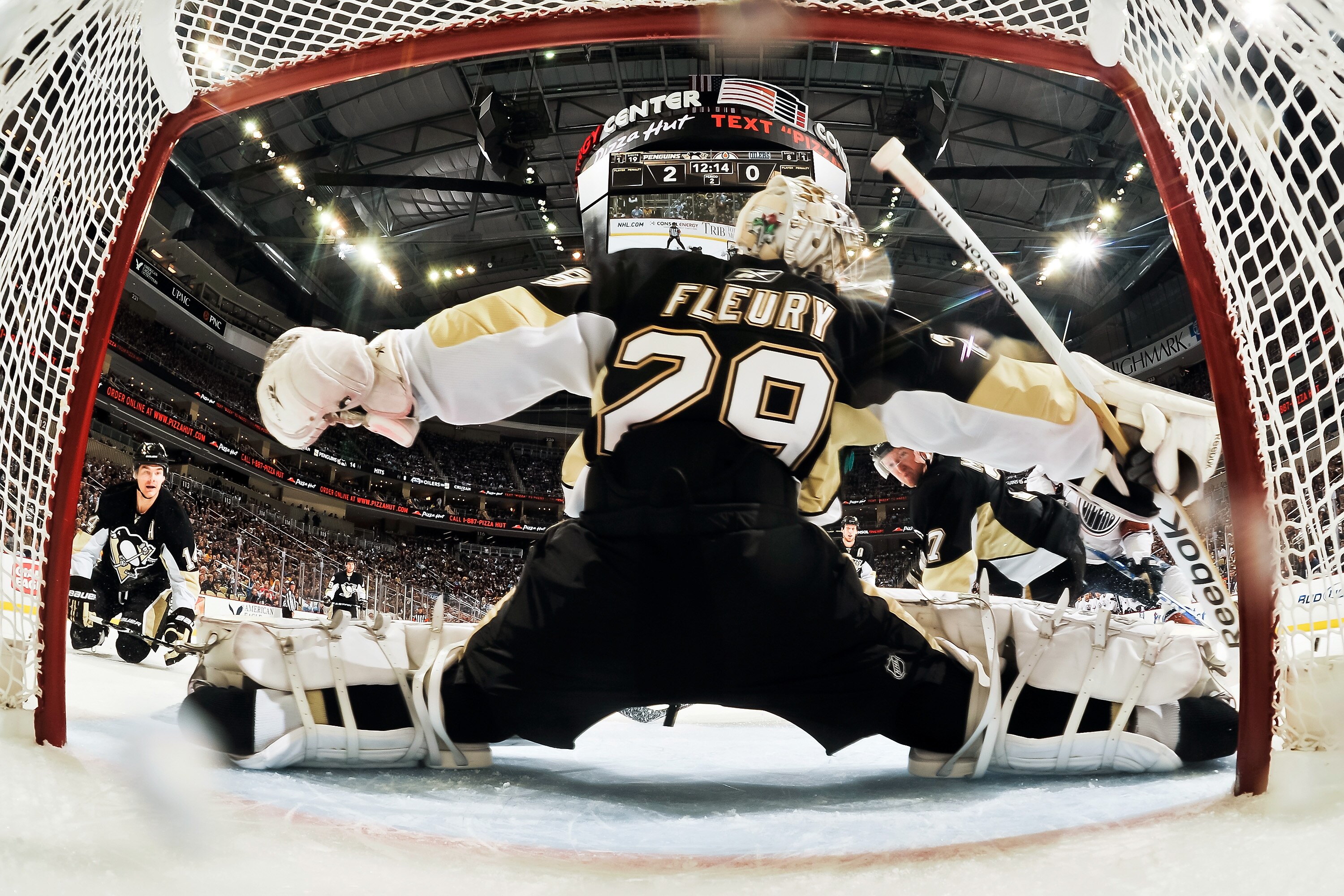 PITTSBURGH, PA - MARCH 13:  Goaltender Marc-Andre Fleury #29 of the Pittsburgh Penguins makes a save against the Edmonton Oilers on March 13, 2011 at CONSOL Energy Center in Pittsburgh, Pennsylvania.  (Photo by Jamie Sabau/Getty Images)