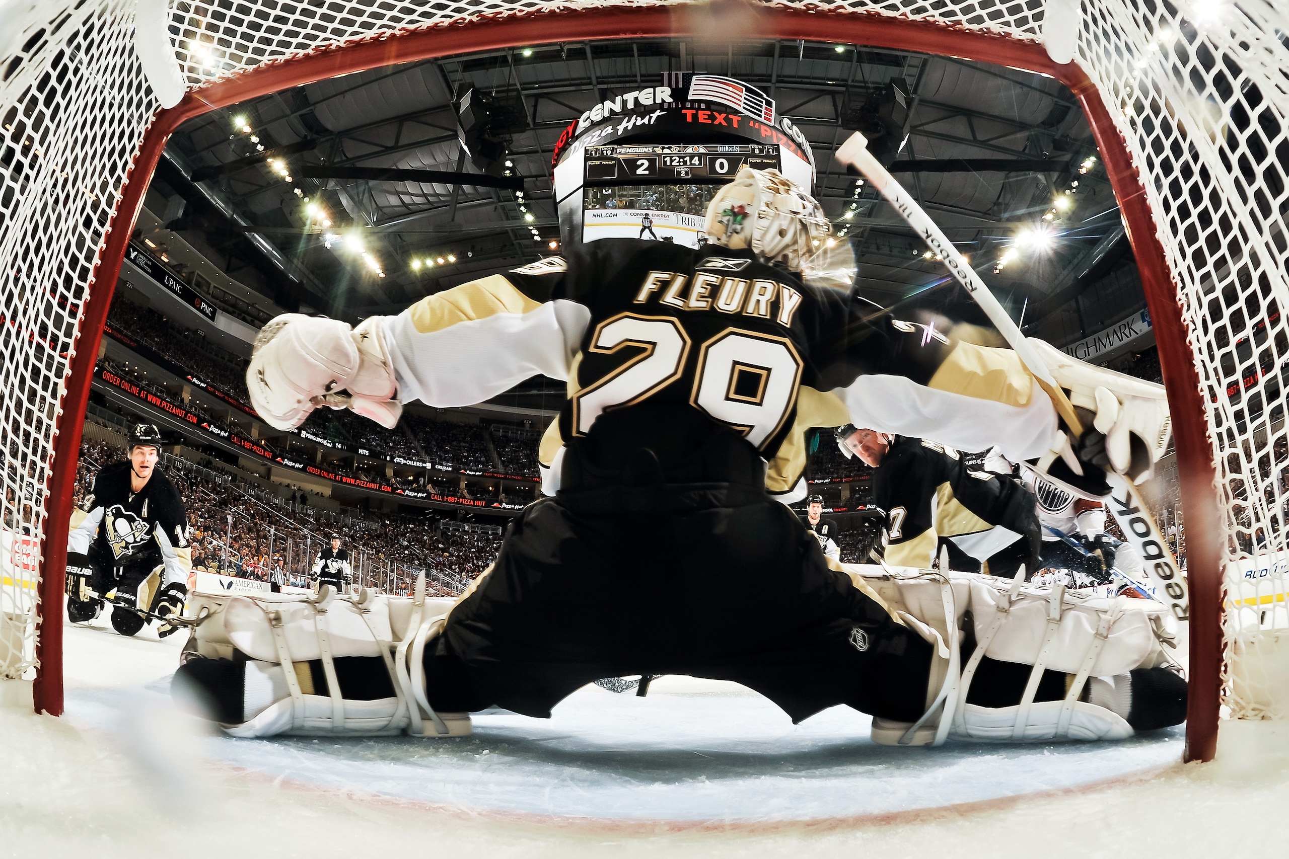 PITTSBURGH, PA - MARCH 13:  Goaltender Marc-Andre Fleury #29 of the Pittsburgh Penguins makes a save against the Edmonton Oilers on March 13, 2011 at CONSOL Energy Center in Pittsburgh, Pennsylvania.  (Photo by Jamie Sabau/Getty Images)