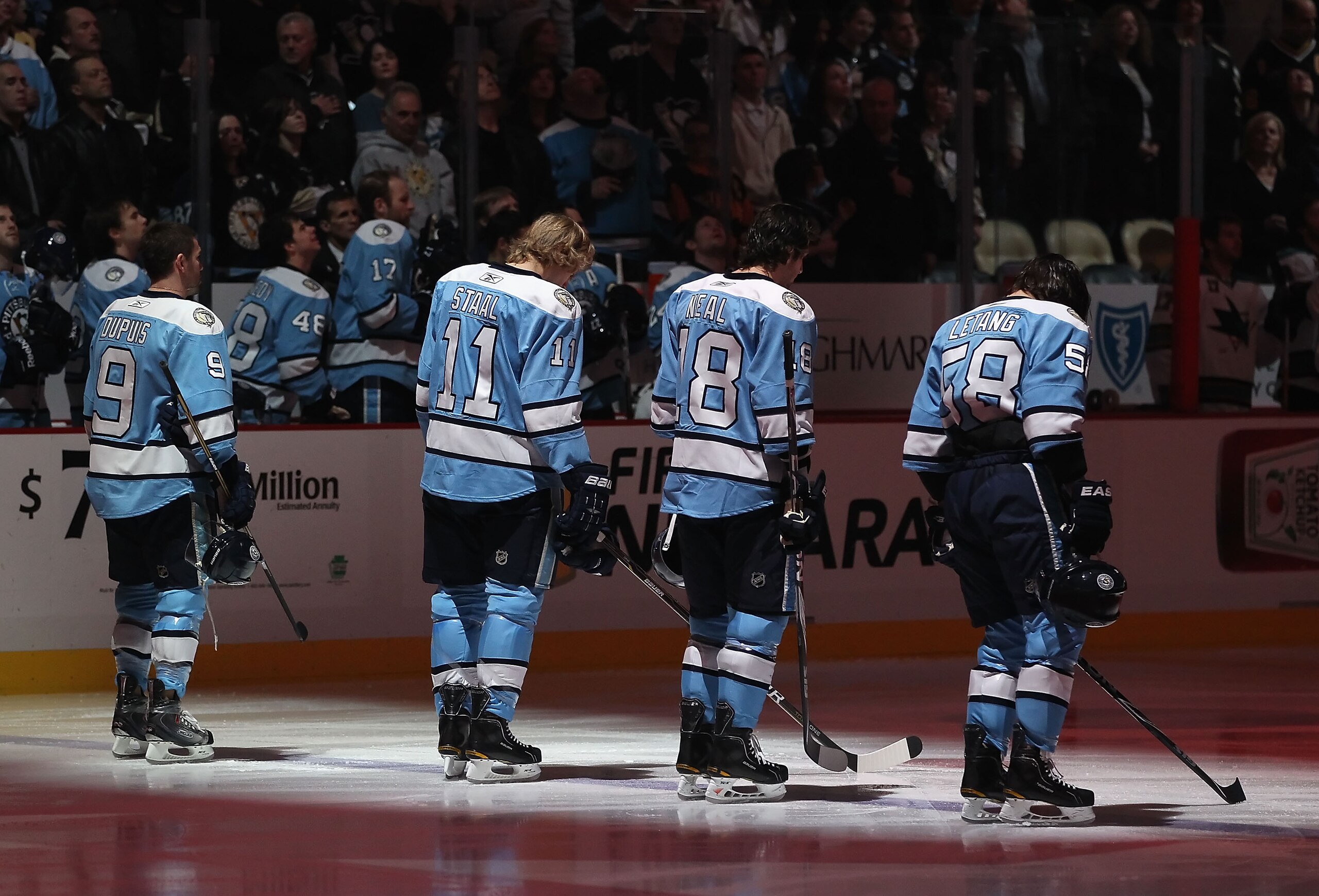 PITTSBURGH, PA - FEBRUARY 23:  (L-R) Pascal Dupuis #9, Jordan Staal #11, James Neal #18 and Kris Letang #58 of the Pittsburgh Penguins stand attended for the National Anthem before the NHL game against the San Jose Sharks at Consol Energy Center on Februa