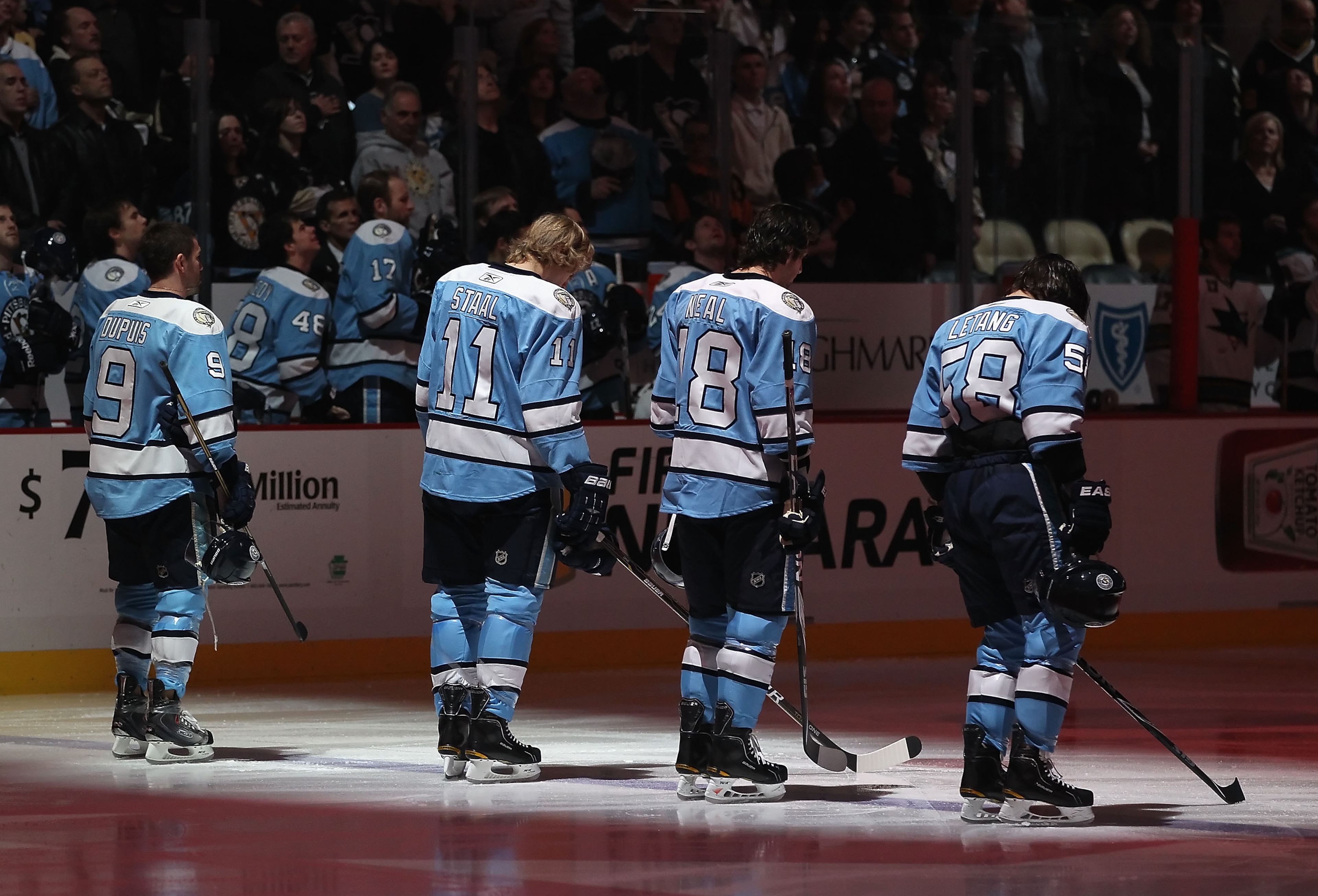 PITTSBURGH, PA - FEBRUARY 23:  (L-R) Pascal Dupuis #9, Jordan Staal #11, James Neal #18 and Kris Letang #58 of the Pittsburgh Penguins stand attended for the National Anthem before the NHL game against the San Jose Sharks at Consol Energy Center on Februa