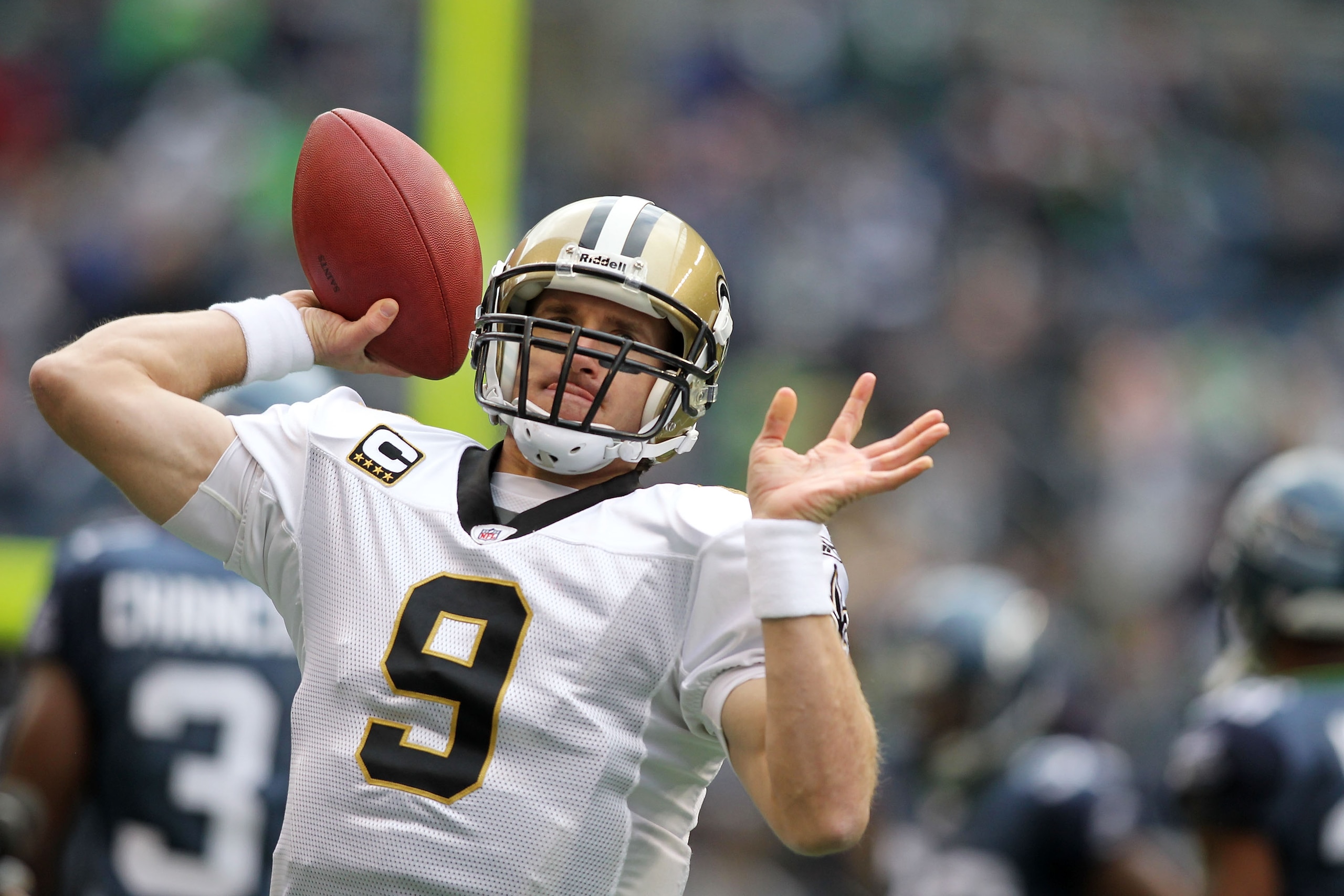 SEATTLE, WA - JANUARY 08:  Quarterback Drew Brees #9 of the New Orleans Saints throws the ball against the Seattle Seahawks during the 2011 NFC wild-card playoff game at Qwest Field on January 8, 2011 in Seattle, Washington.  (Photo by Jonathan Ferrey/Get
