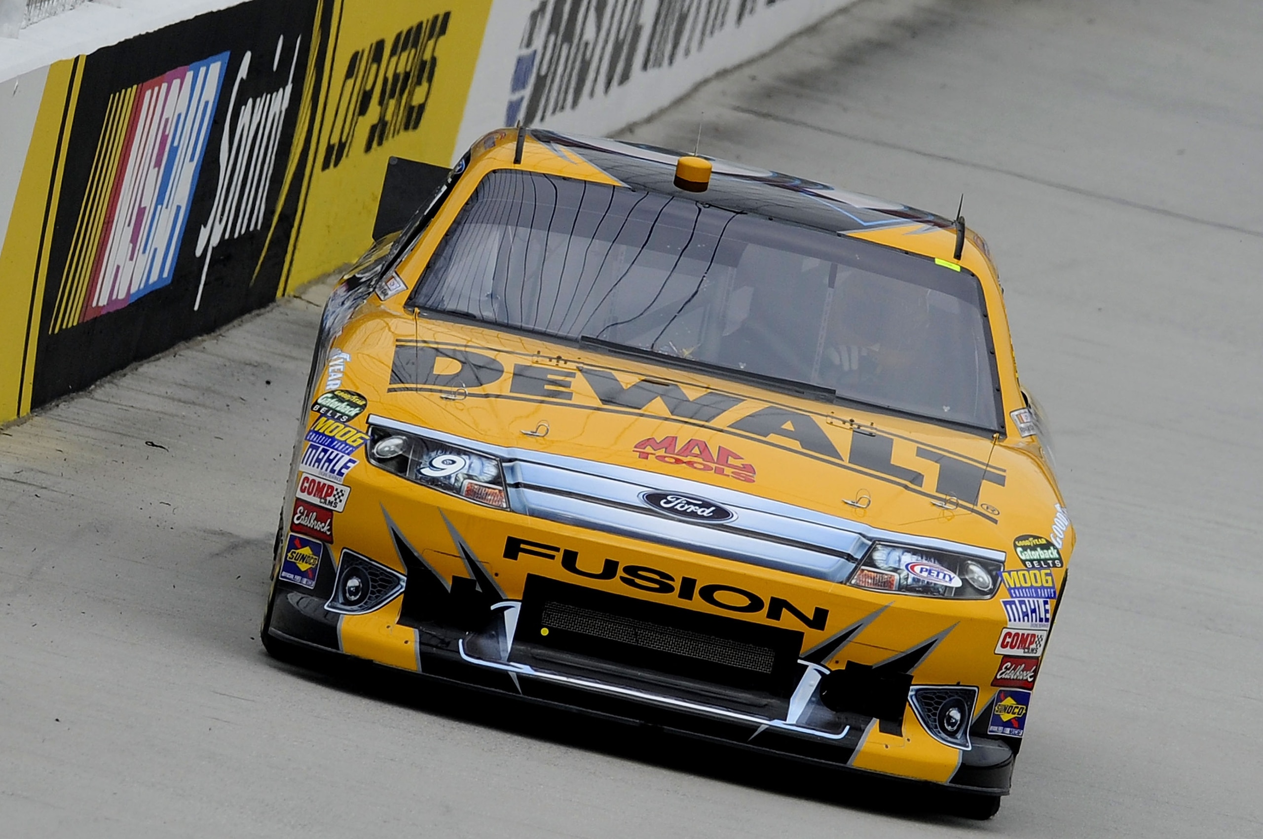 BRISTOL, TN - MARCH 18:  Marcos Ambrose drives the #9 Dewalt Ford during practice for the NASCAR Sprint Cup Series Jeff Byrd 500 Presented By Food City at Bristol Motor Speedway on March 18, 2011 in Bristol, Tennessee.  (Photo by John Harrelson/Getty Imag