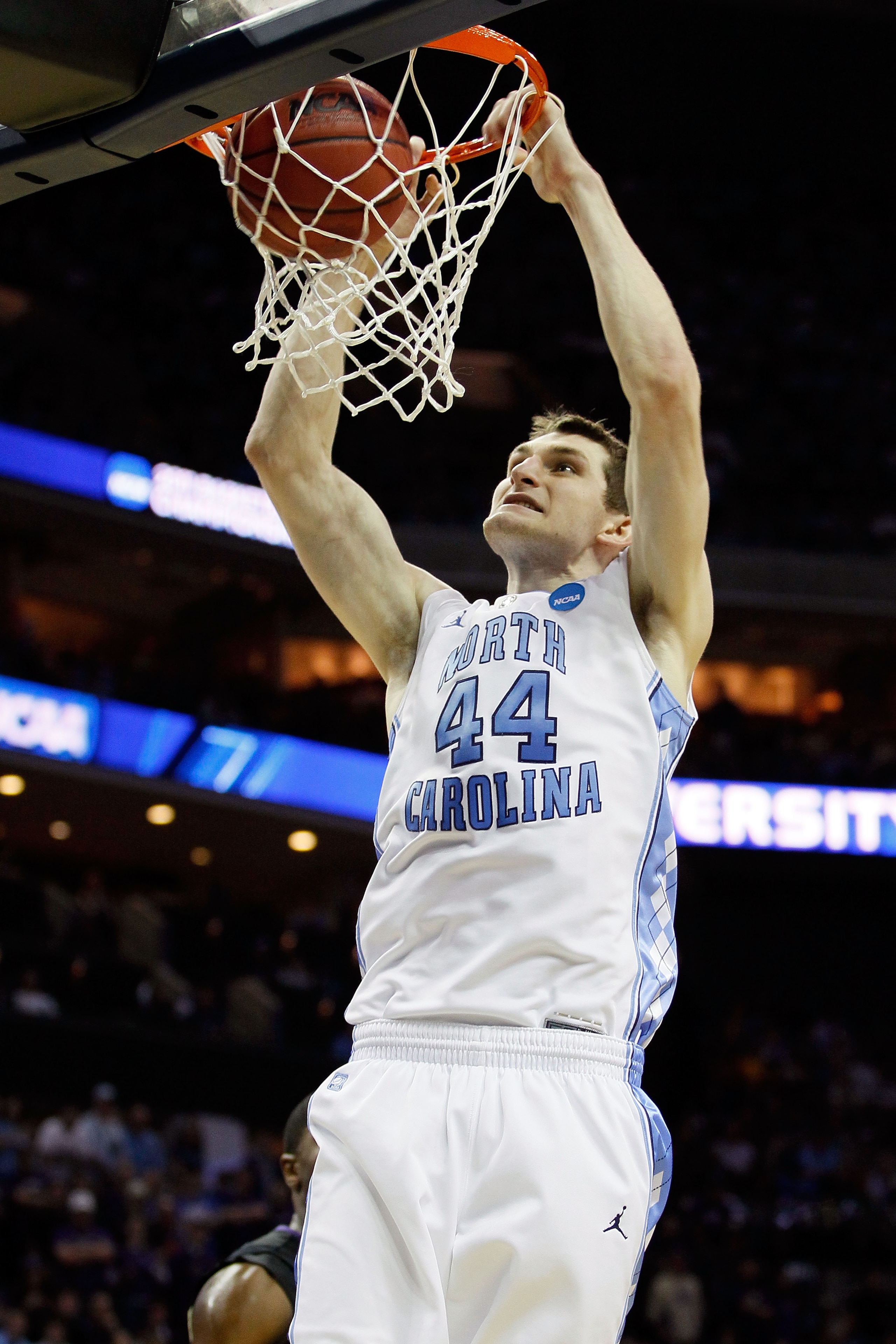 CHARLOTTE, NC - MARCH 20: Tyler Zeller #44 of the North Carolina Tar Heels dunks the ball in the second half while taking on the Washington Huskies during the third round of the 2011 NCAA men's basketball tournament at Time Warner Cable Arena on March 20 CHARLOTTE, NC - MARCH 20: Tyler Zeller #44 of the North Carolina Tar Heels dunks the ball in the second half while taking on the Washington Huskies during the third round of the 2011 NCAA men's basketball tournament at Time Warner Cable Arena on March 20
