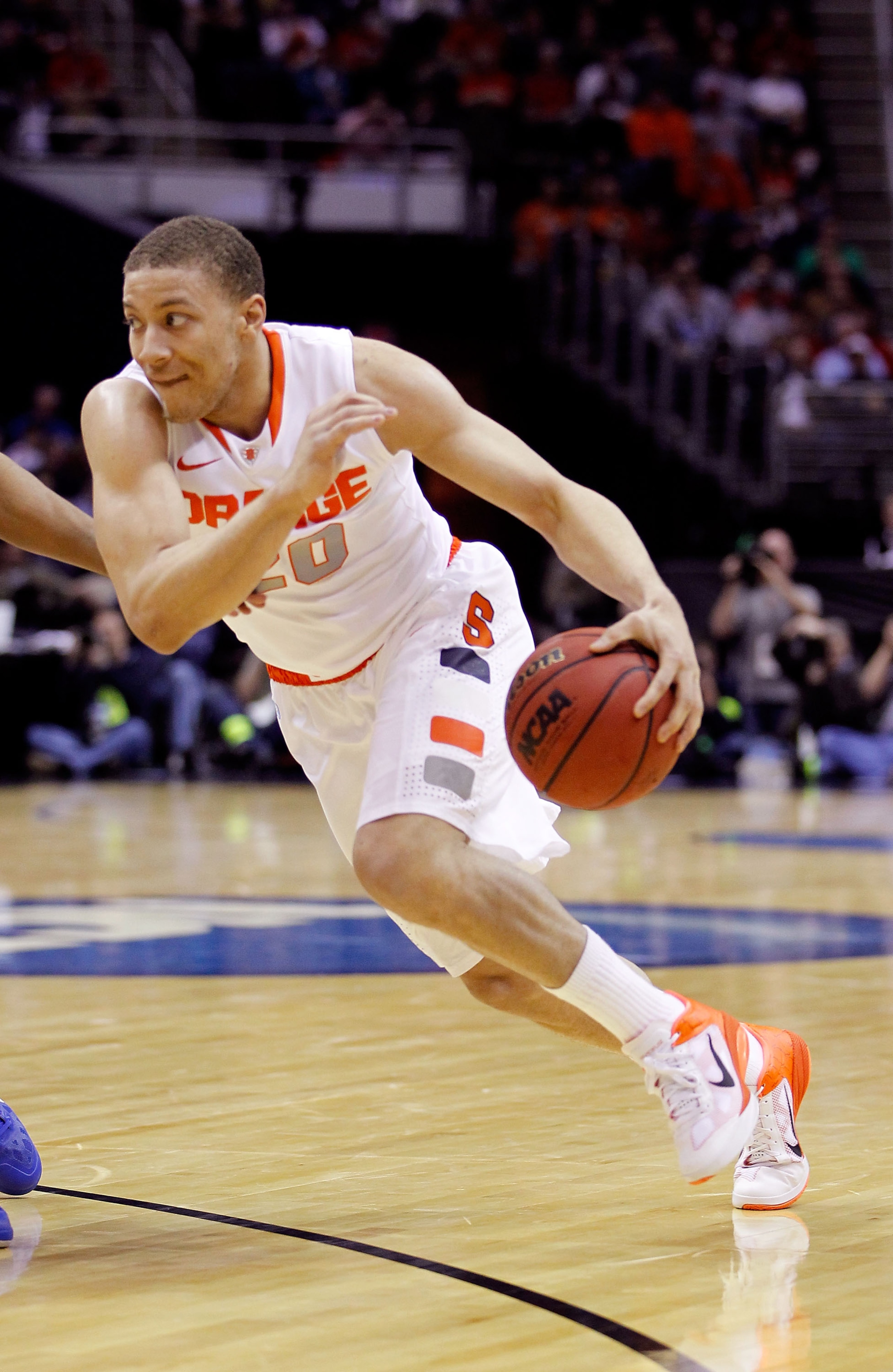 CLEVELAND, OH - MARCH 18: Brandon Triche #20 of the Syracuse Orange drives with the ball against the Indiana State Sycamores during the second round of the 2011 NCAA men's basketball tournament at Quicken Loans Arena on March 18, 2011 in Cleveland, Ohio.