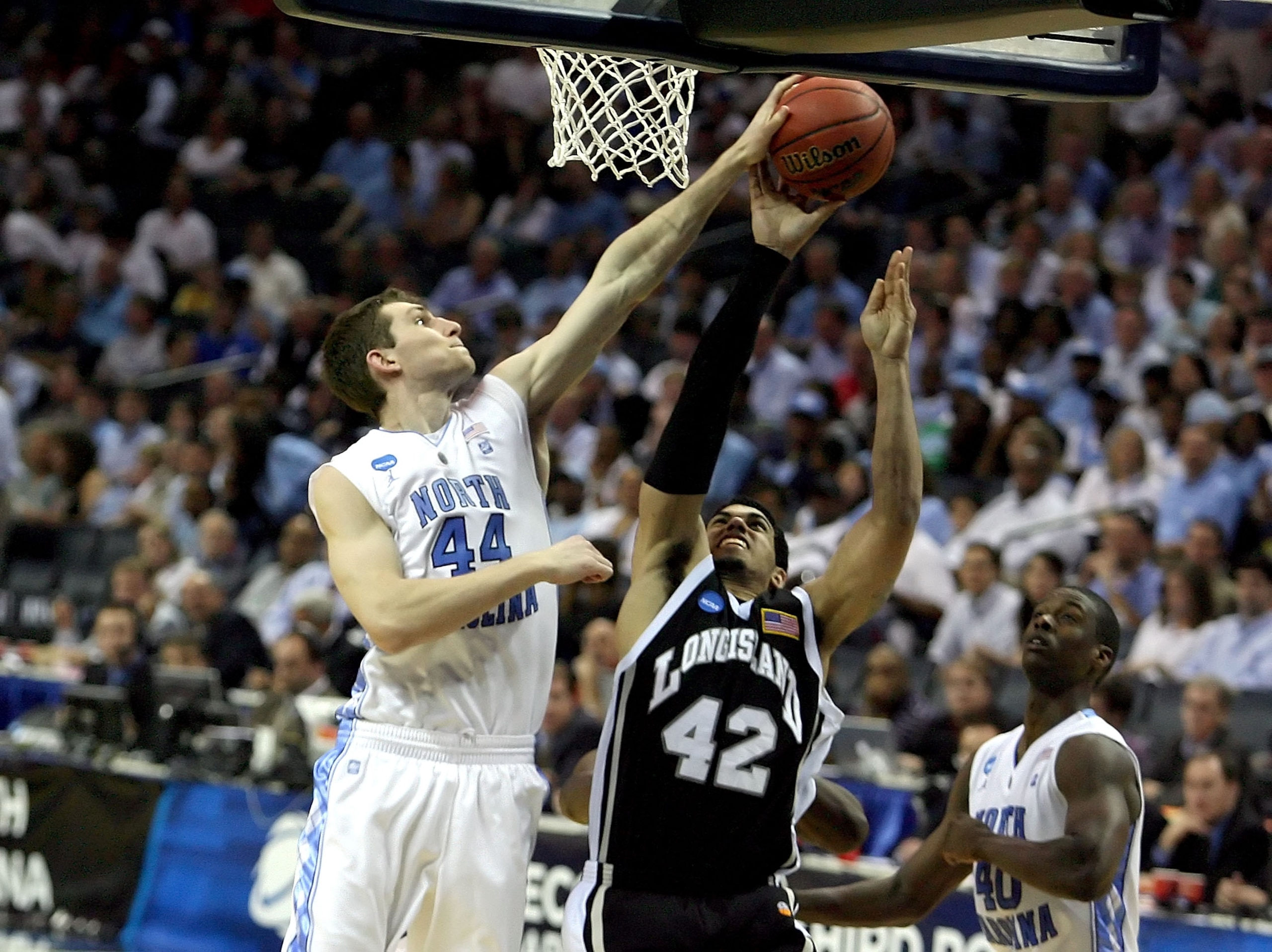 CHARLOTTE, NC - MARCH 18:  Julian Boyd #42 of the Long Island Blackbirds goes up for a shot over Tyler Zeller #44 of the North Carolina Tar Heels in the second half during the second round of the 2011 NCAA men's basketball tournament at Time Warner Cable