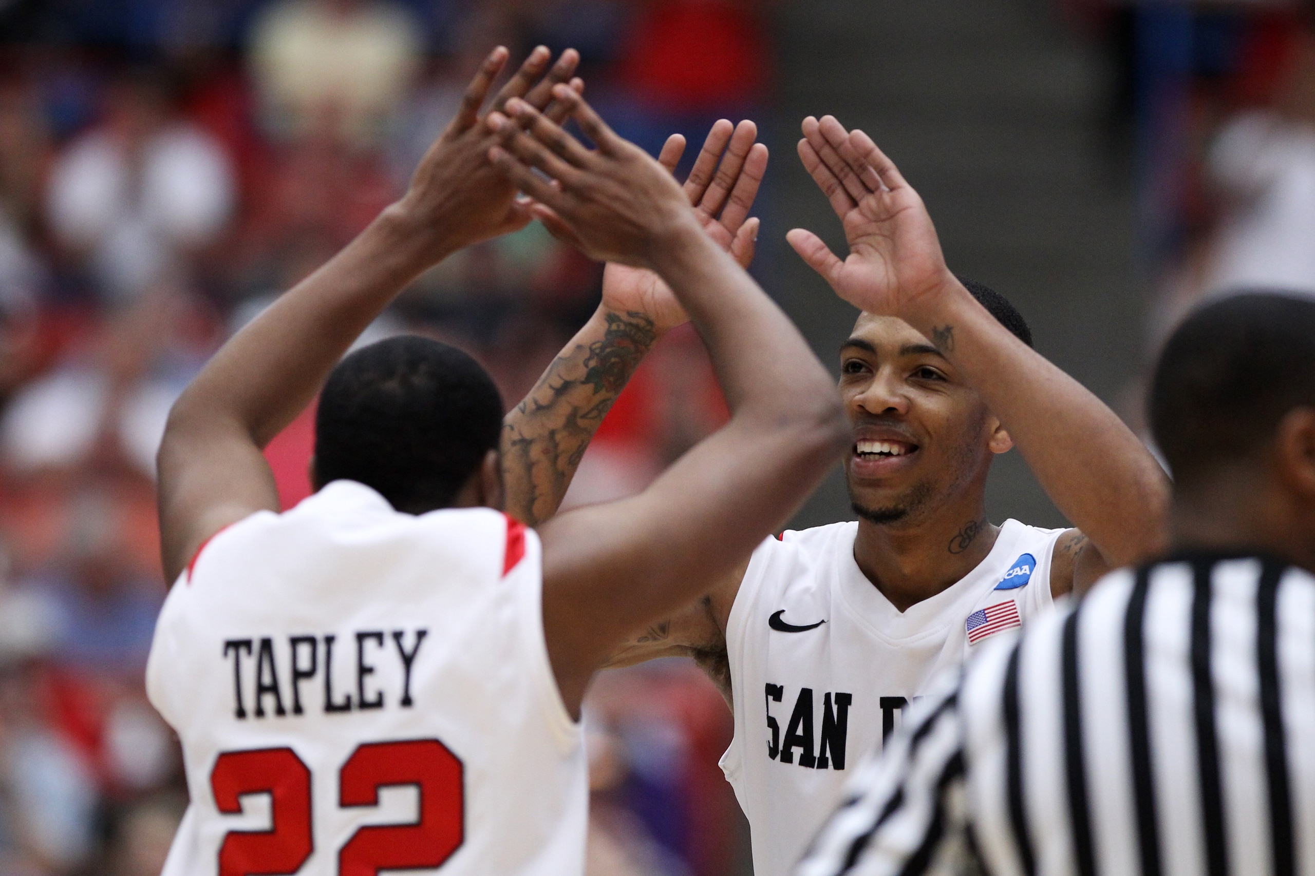TUCSON, AZ - MARCH 19:  Chase Tapley #22 and Malcolm Thomas #4 of the San Diego State Aztecs celebrate during their game against the Temple Owls the third round of the 2011 NCAA men's basketball tournament at McKale Center on March 19, 2011 in Tucson, Ari