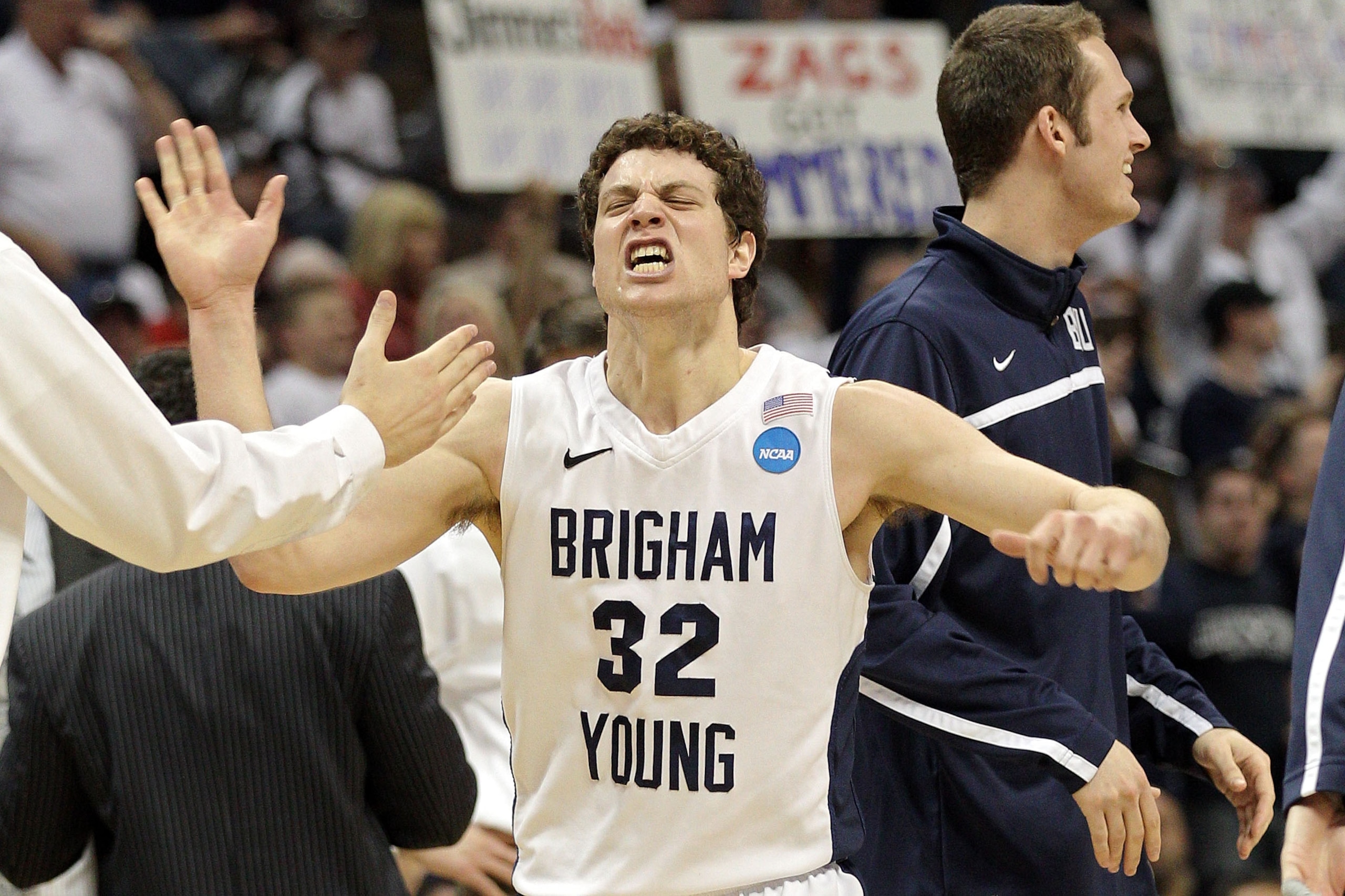 DENVER, CO - MARCH 19:  Jimmer Fredette #32 of the Brigham Young Cougars celebrates after a play against the Gonzaga Bulldogs during the third round of the 2011 NCAA men's basketball tournament at Pepsi Center on March 19, 2011 in Denver, Colorado.  (Phot