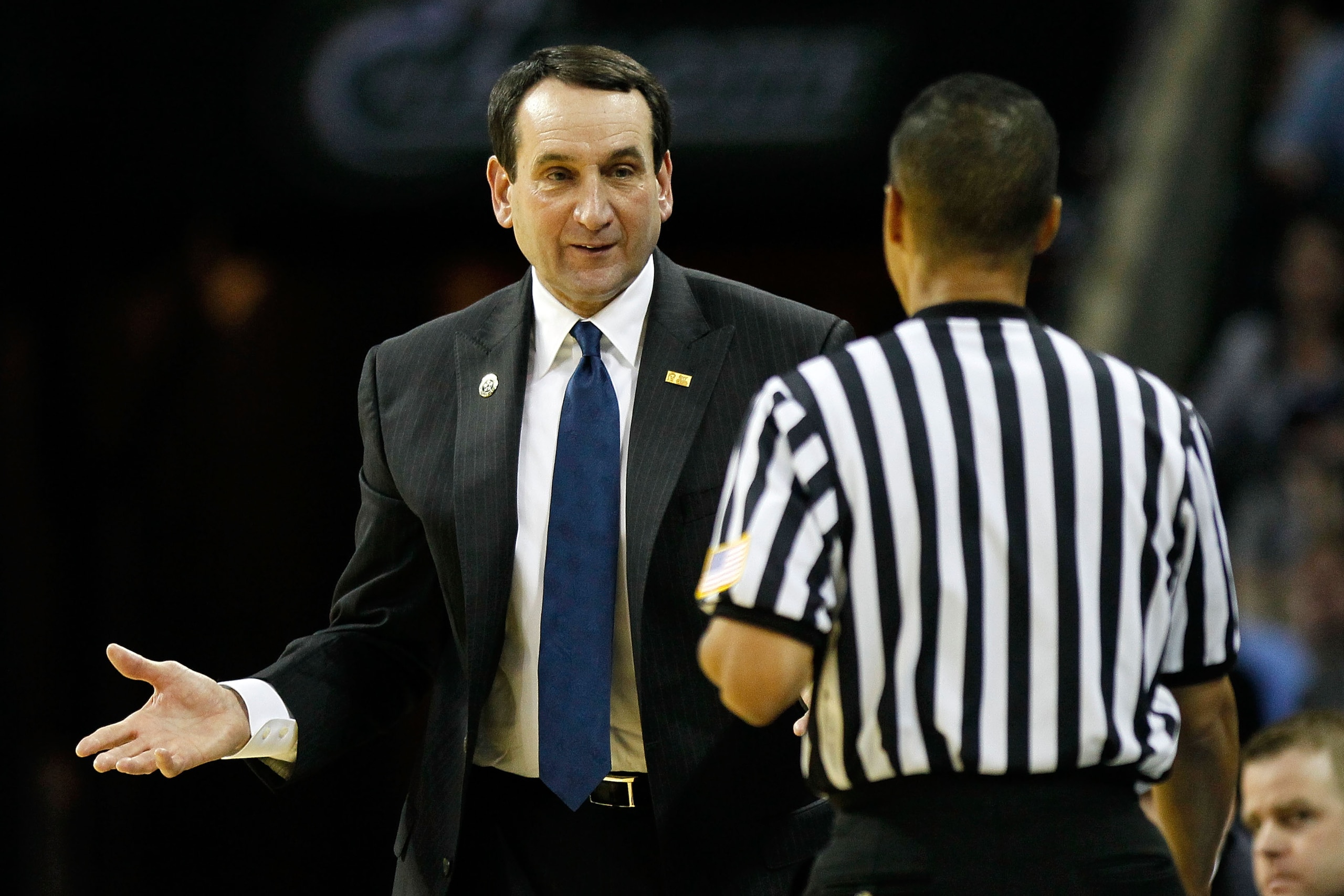 CHARLOTTE, NC - MARCH 20:  Head coach Mike Krzyzewski of the Duke Blue Devils looks over at a referee in the first half while taking on the Michigan Wolverines during the third round of the 2011 NCAA men's basketball tournament at Time Warner Cable Arena