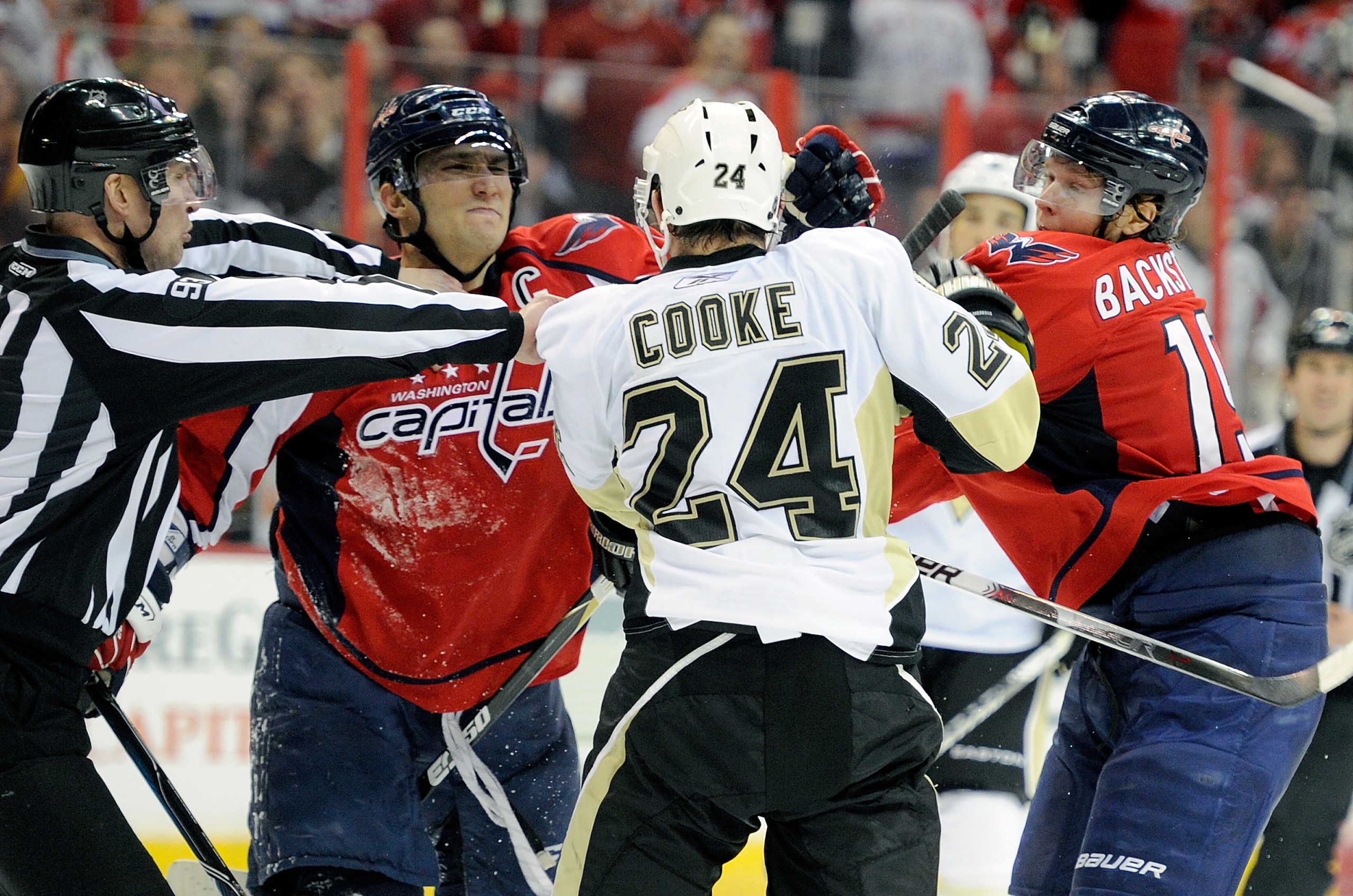 WASHINGTON, DC - FEBRUARY 06:  Alex Ovechkin #8 and Nicklas Backstrom #19 of the Washington Capitals rough it up with Matt Cooke #24 of the Pittsburgh Penguins at the Verizon Center on February 6, 2011 in Washington, DC.  (Photo by Greg Fiume/Getty Images