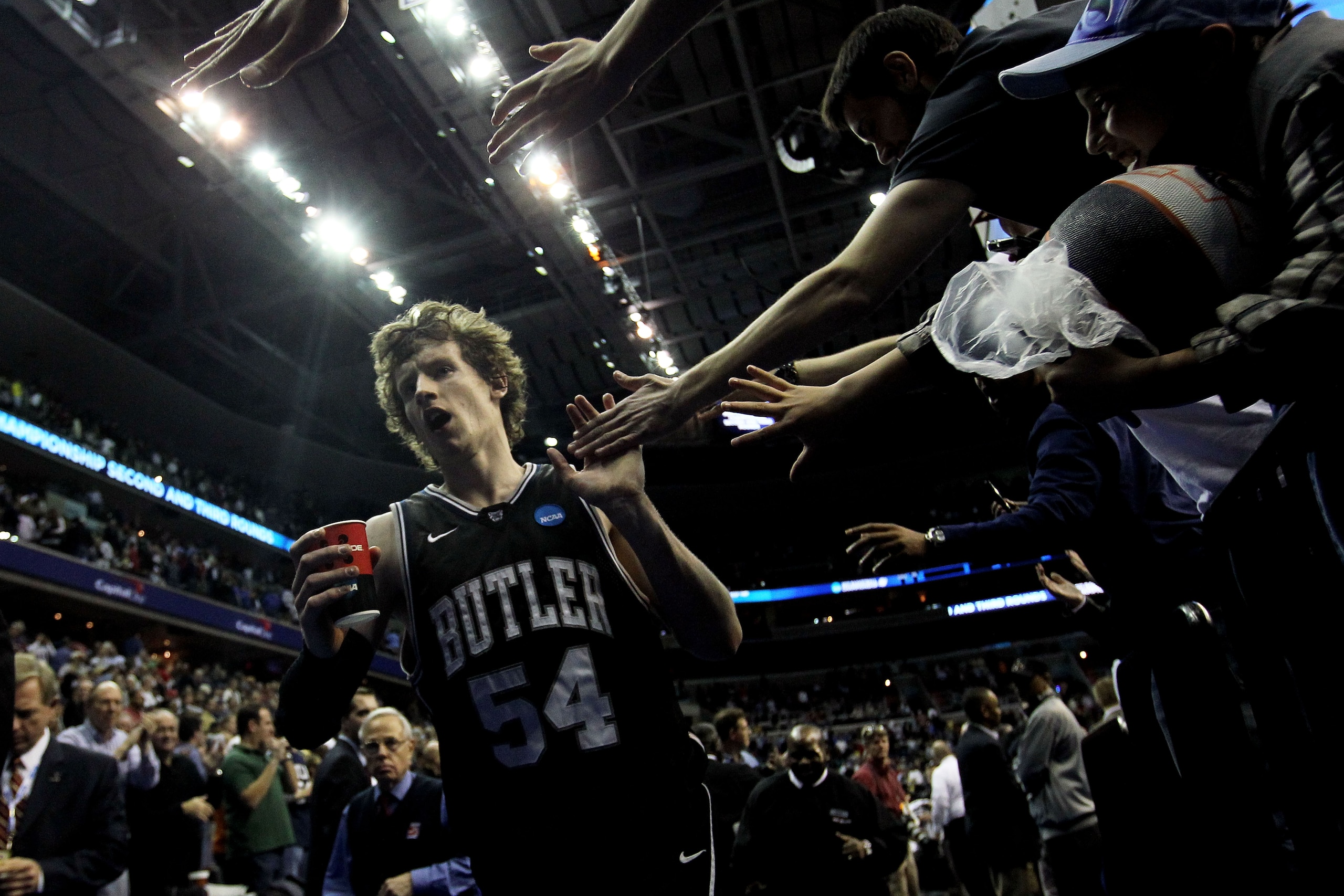 WASHINGTON - MARCH 19:  Matt Howard #54 of the Butler Bulldogs celebrates with fans after their victory over the Pittsburgh Panthers during the third round of the 2011 NCAA men's basketball tournament at Verizon Center on March 19, 2011 in Washington, DC.