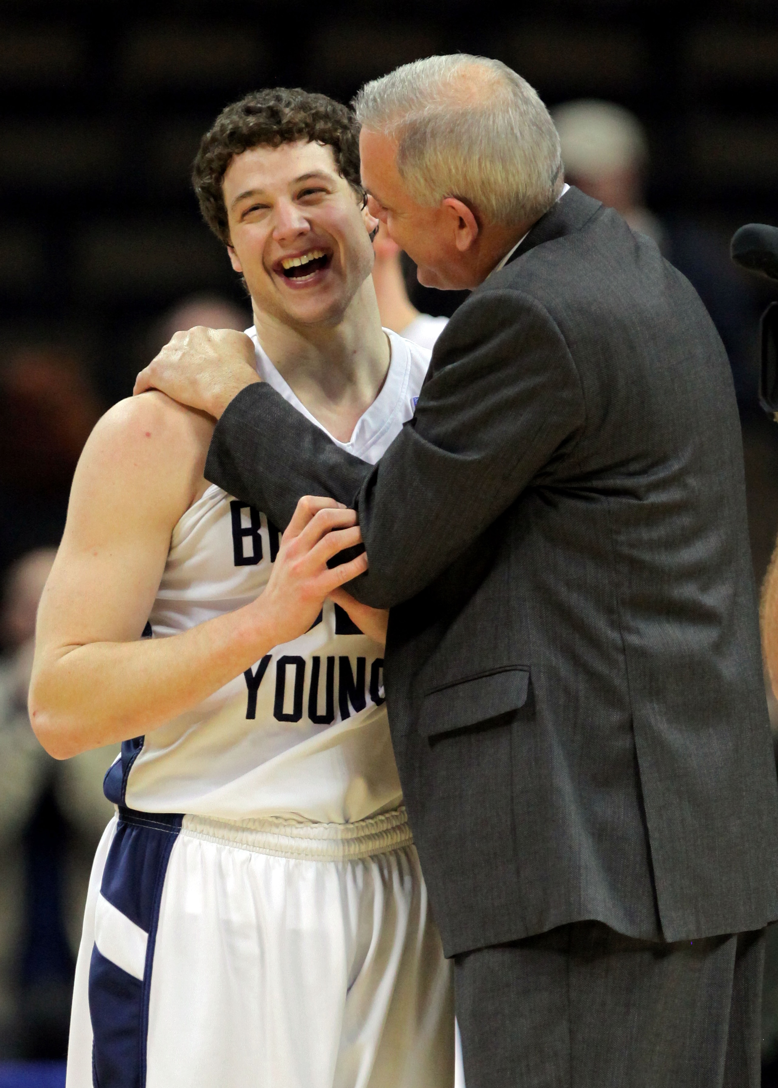 DENVER, CO - MARCH 19:  Jimmer Fredette #32 celebrates with head coach Dave Rose of the Brigham Young Cougars after defeating the Gonzaga Bulldogs during the third round of the 2011 NCAA men's basketball tournament at Pepsi Center on March 19, 2011 in Den
