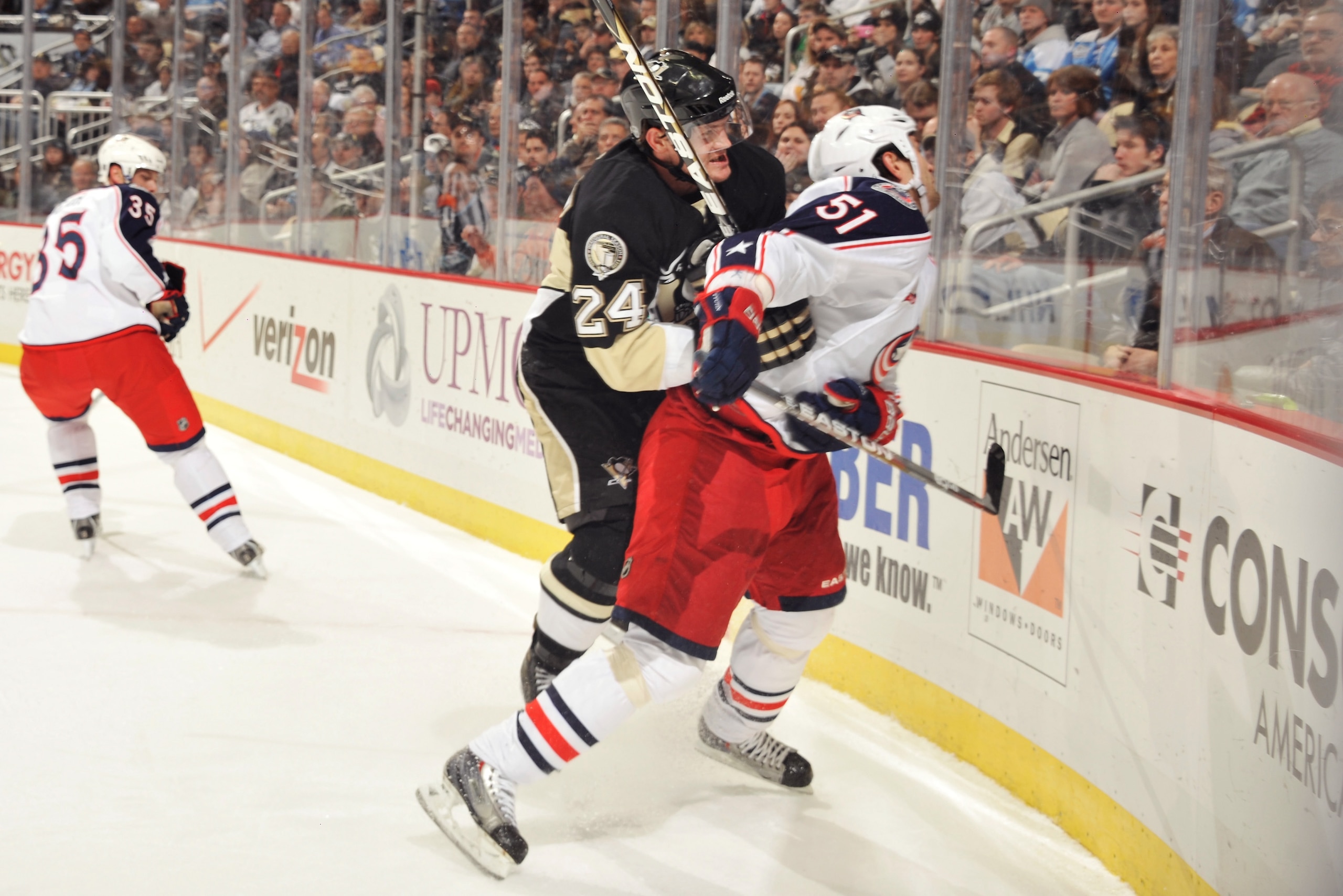 PITTSBURGH, PA - FEBRUARY 8:  Matt Cooke #24 of the Pittsburgh Penguins checks Fedor Tyutin #51 of the Columbus Blue Jackets in the first period on February 8, 2011 at CONSOL Energy Center in Pittsburgh, Pennsylvania. Cooke was assessed a five-minute majo