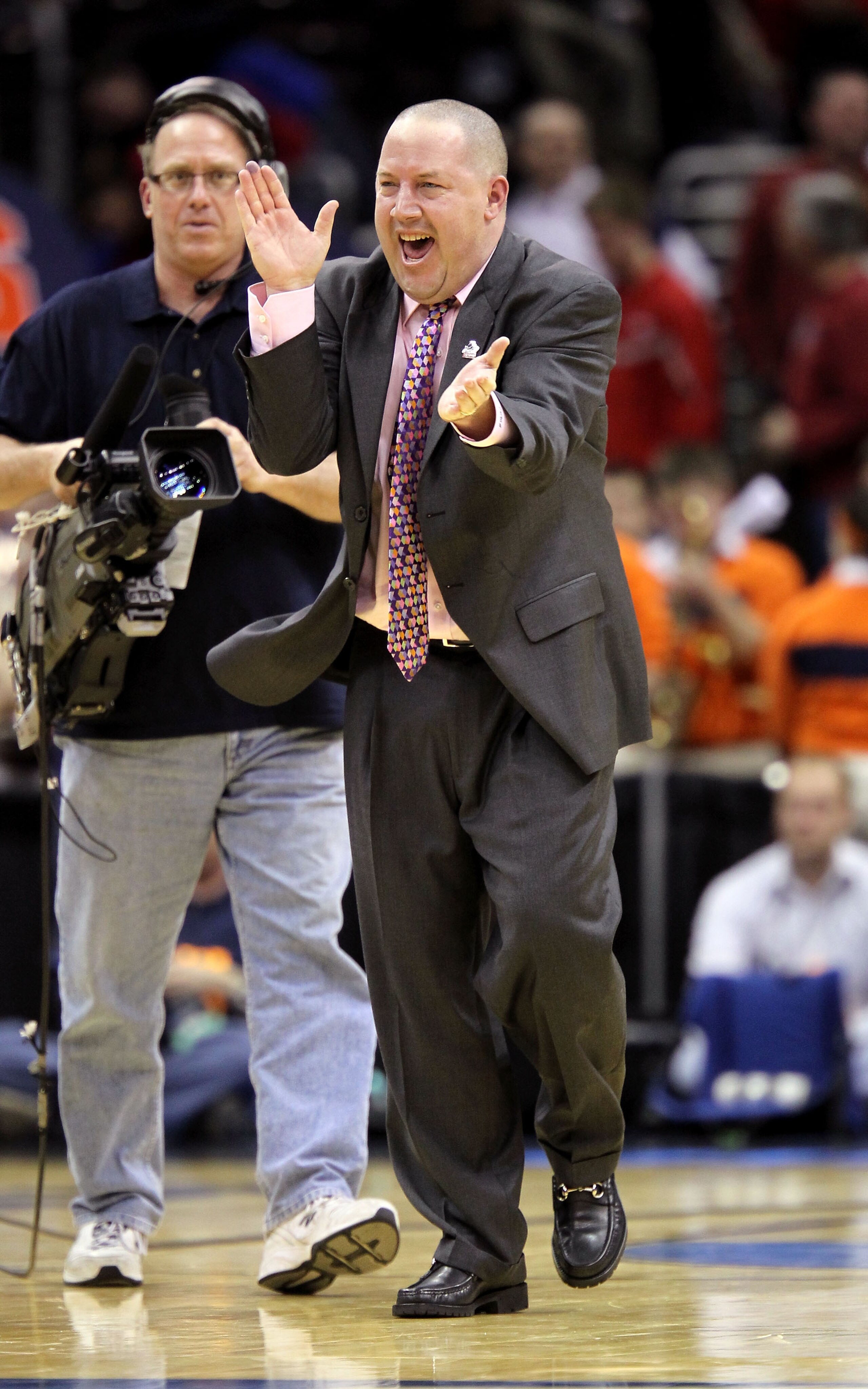 CLEVELAND, OH - MARCH 20: Head coach Buzz Williams of the Marquette Golden Eagles celebrates on the court after defeating the Syracuse Orange during the third of the 2011 NCAA men's basketball tournament at Quicken Loans Arena on March 20, 2011 in Clevela