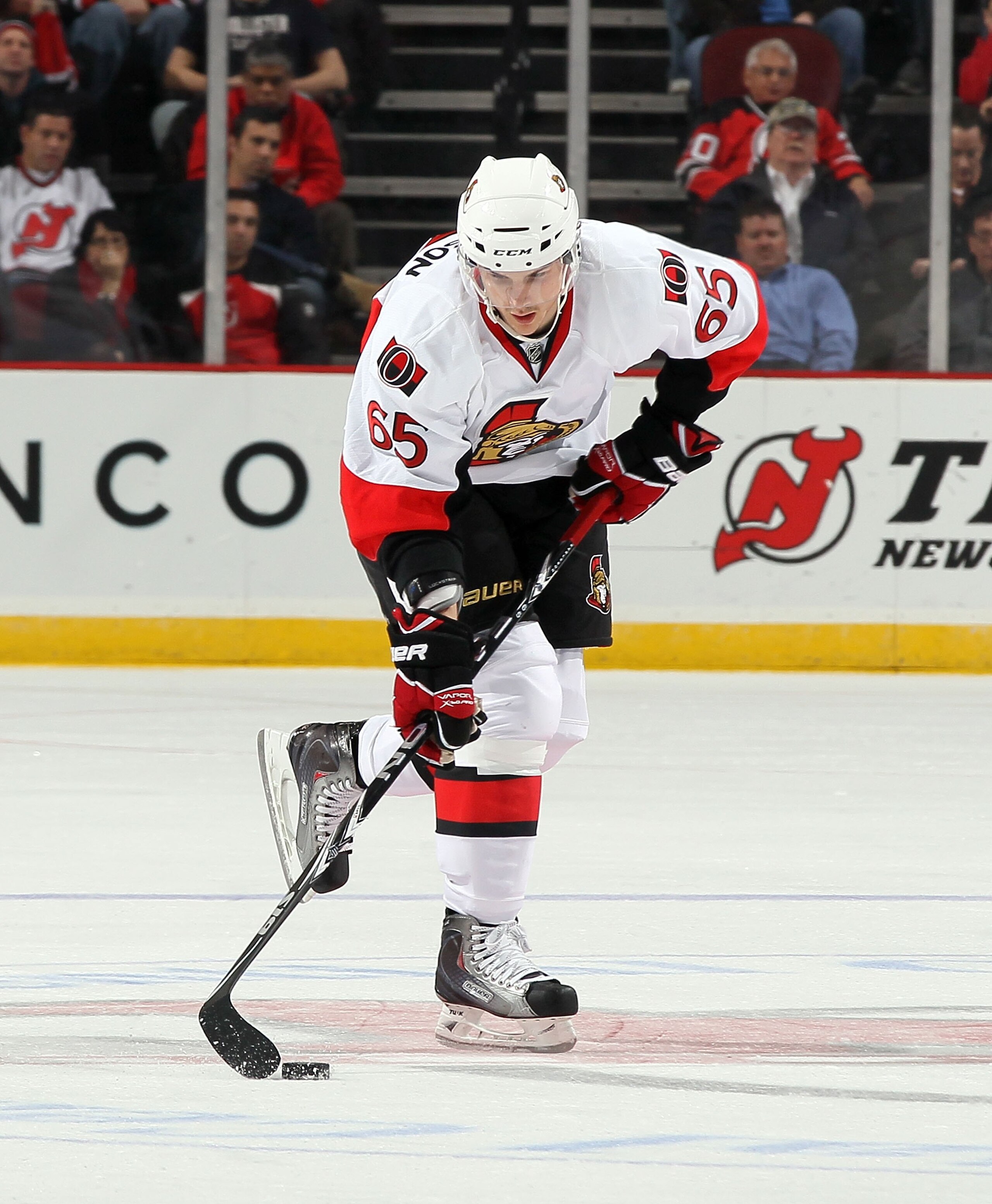 NEWARK, NJ - MARCH 08:  Erik Karlsson #65 of the Ottawa Senators skates against the New Jersey Devils at the Prudential Center on March 8, 2011 in Newark, New Jersey.  (Photo by Jim McIsaac/Getty Images)