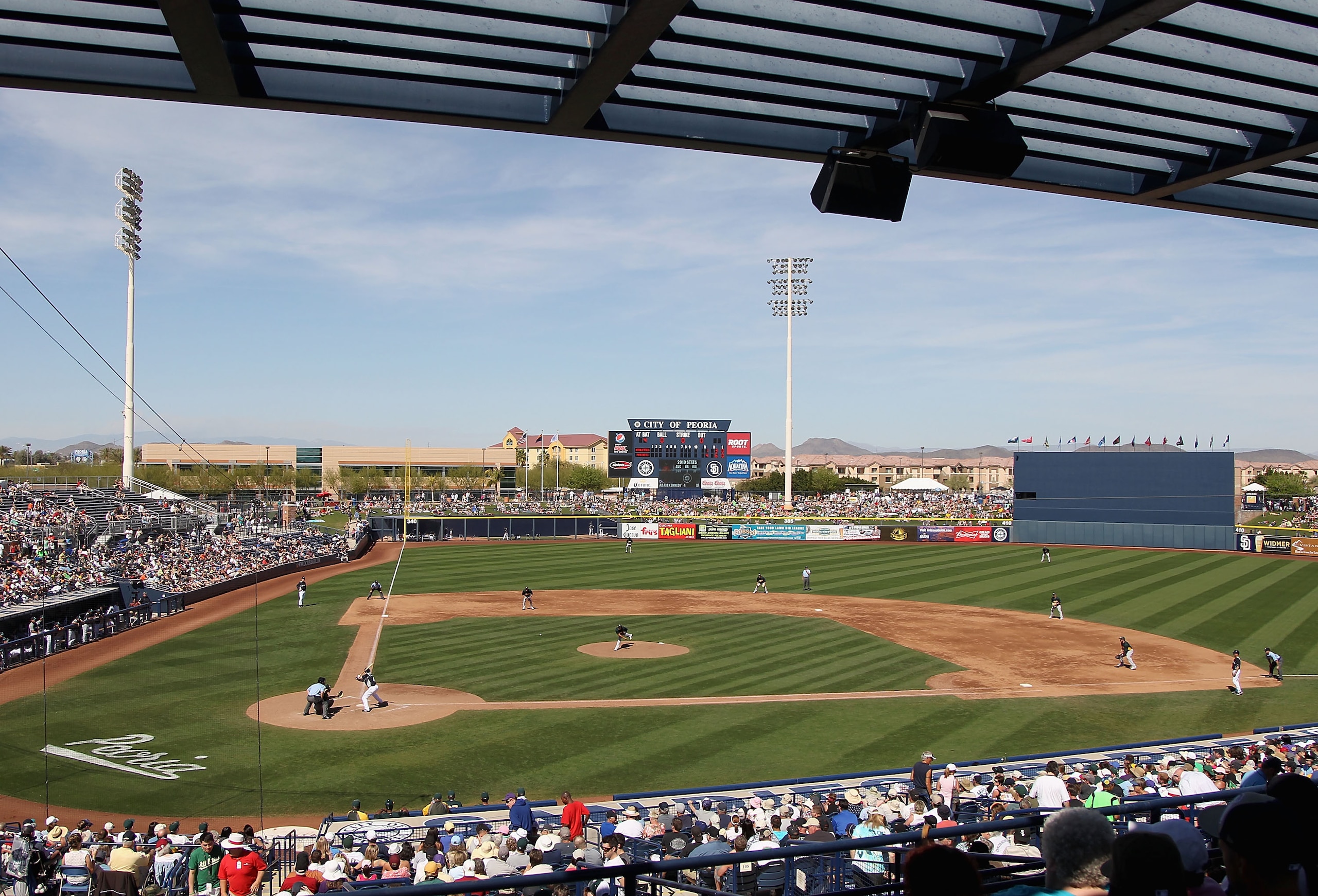 PEORIA, AZ - MARCH 12: General view as starting pitcher Guillermo Moscoso #74 of the Oakland Athletics pitches to Adam Kennedy #4 of the Seattle Mariners during the spring training game at Peoria Stadium on March 12, 2011 in Peoria, Arizona. (Photo by C PEORIA, AZ - MARCH 12: General view as starting pitcher Guillermo Moscoso #74 of the Oakland Athletics pitches to Adam Kennedy #4 of the Seattle Mariners during the spring training game at Peoria Stadium on March 12, 2011 in Peoria, Arizona. (Photo by C