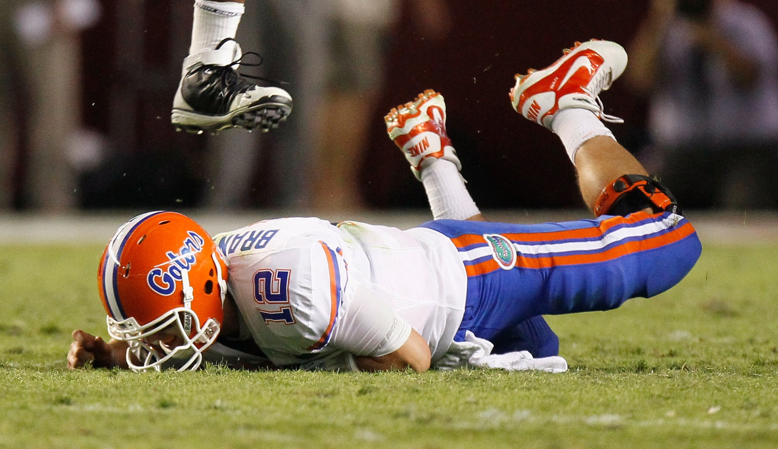 TUSCALOOSA, AL - OCTOBER 02:  Quarterback John Brantley #12 of the Florida Gators falls to the ground after being pressured by the Alabama Crimson Tide at Bryant-Denny Stadium on October 2, 2010 in Tuscaloosa, Alabama.  (Photo by Kevin C. Cox/Getty Images
