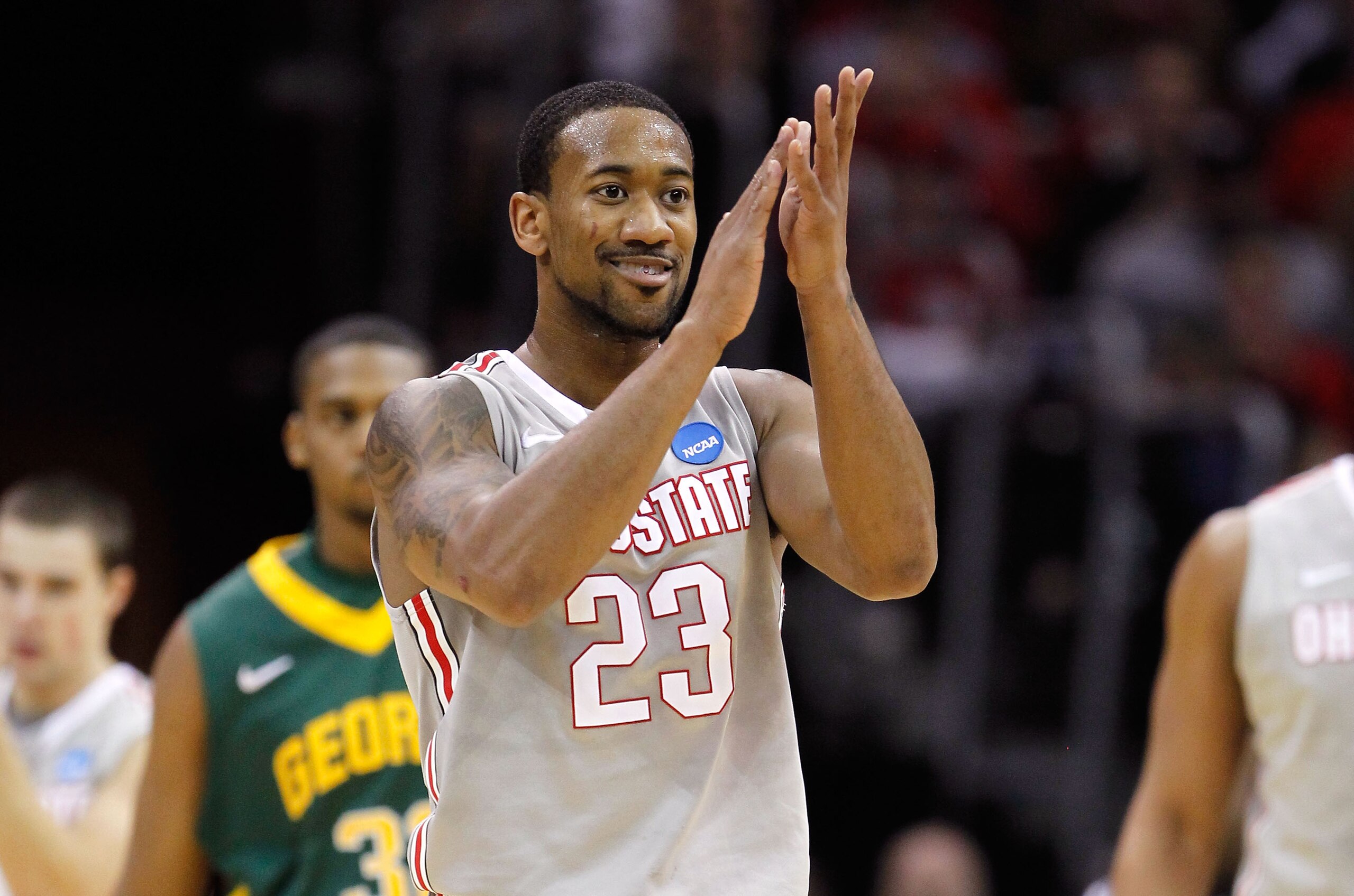 CLEVELAND, OH - MARCH 20: David Lighty #23 of the Ohio State Buckeyes claps after a play in the first half against the George Mason Patriots during the third of the 2011 NCAA men's basketball tournament at Quicken Loans Arena on March 20, 2011 in Clevelan