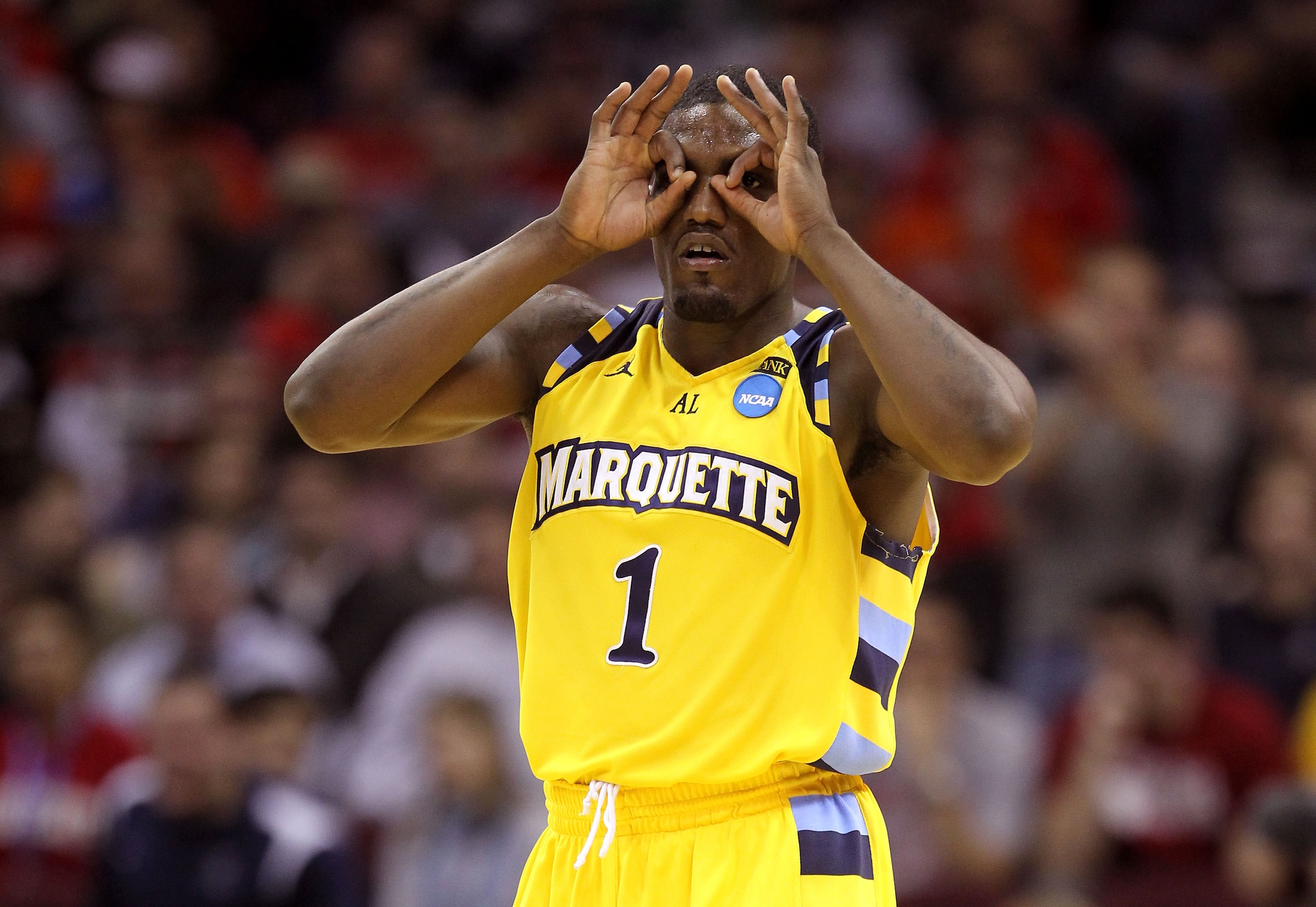 CLEVELAND, OH - MARCH 18: Darius Johnson-Odom #1 of the Marquette Golden Eagles gestures after making a three point basket against the Xavier Musketeers during the second round of the 2011 NCAA men's basketball tournament at Quicken Loans Arena on March 1