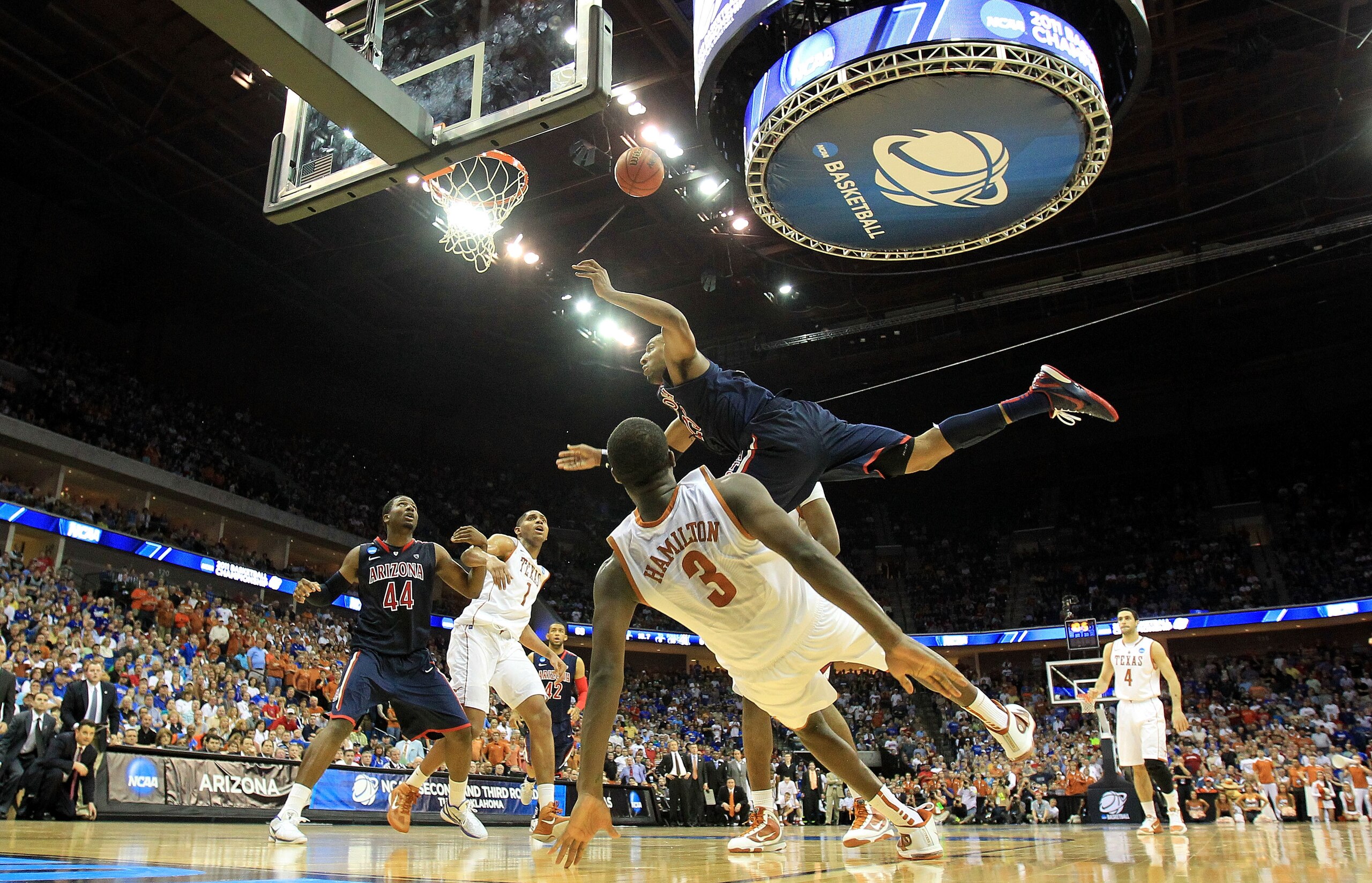 TULSA, OK - MARCH 20:  Derrick Williams #23 of the Arizona Wildcats is fouled by Jordan Hamilton #3 of the Texas Longhorns on the game tying shot during the third round of the 2011 NCAA men's basketball tournament at BOK Center on March 20, 2011 in Tulsa,