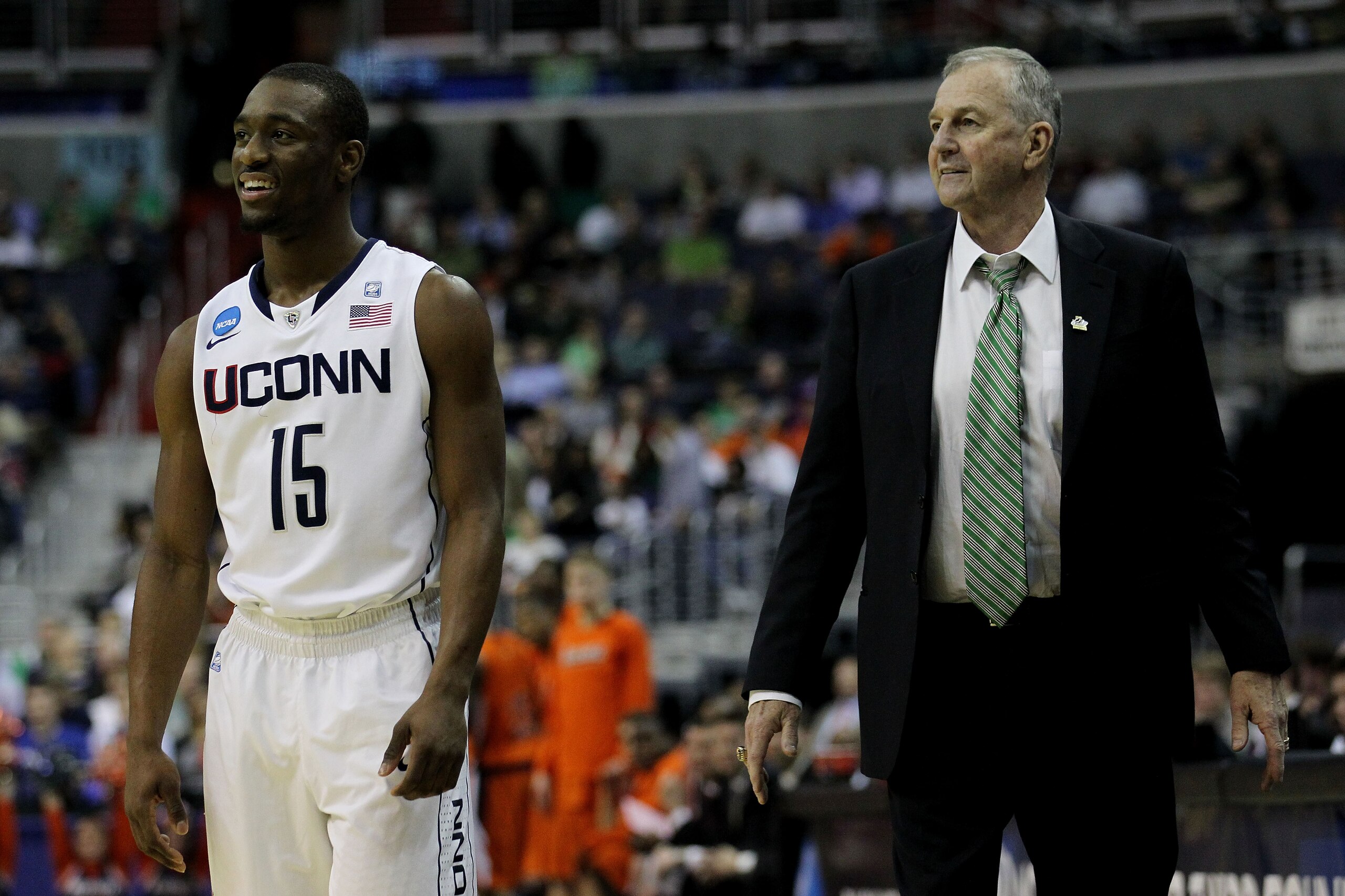 WASHINGTON - MARCH 17:  Head coach Jim Calhoun of the Connecticut Huskies and Kemba Walker #15 smile during their game against the Bucknell Bison during the second round of the 2011 NCAA men's basketball tournament at the Verizon Center on March 17, 2011