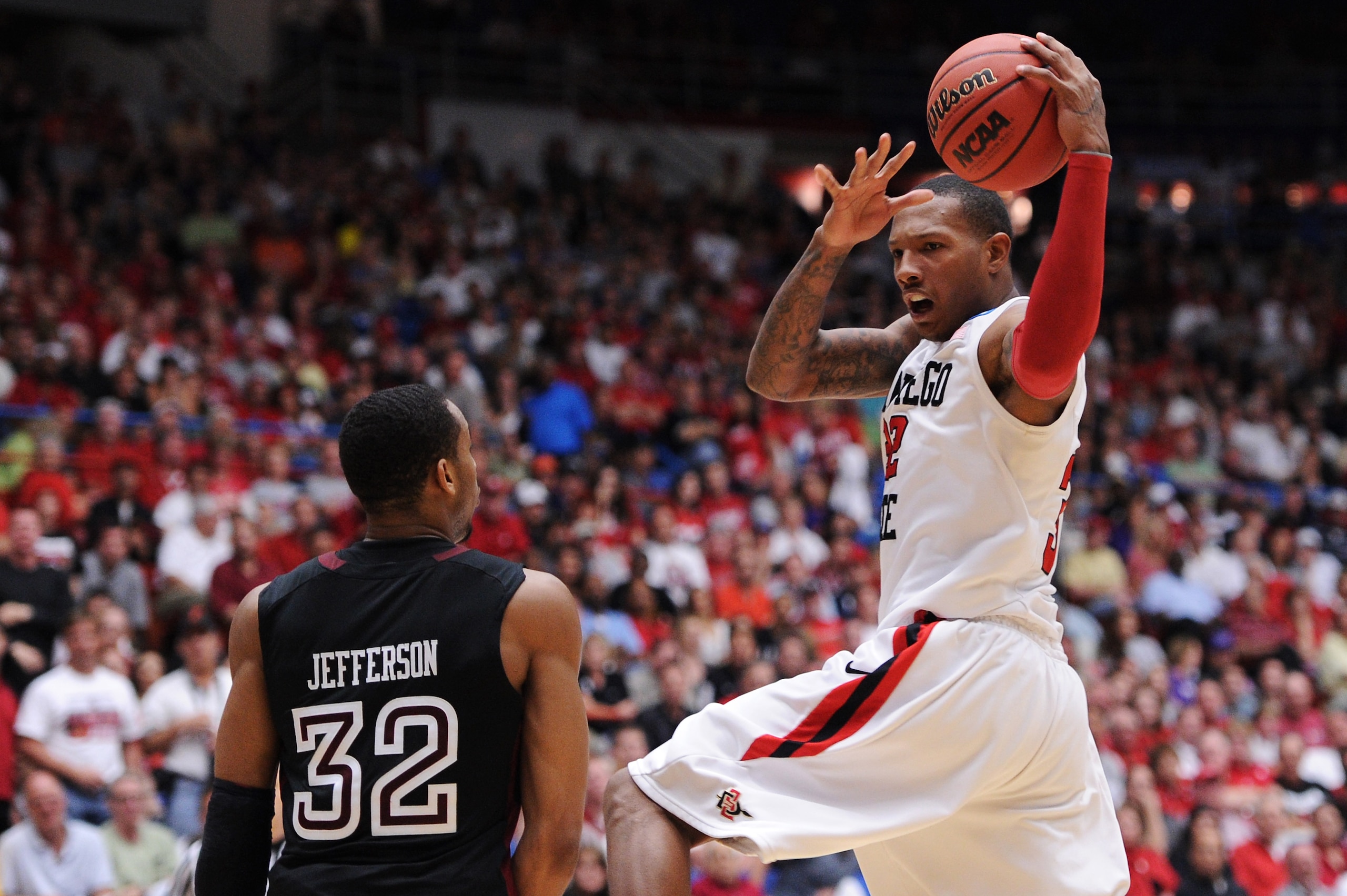 TUCSON, AZ - MARCH 19:  Billy White #32 of the San Diego State Aztecs controls the ball against Rahlir Jefferson #32 of the Temple Owls in the second half during the third round of the 2011 NCAA men's basketball tournament at McKale Center on March 19, 20