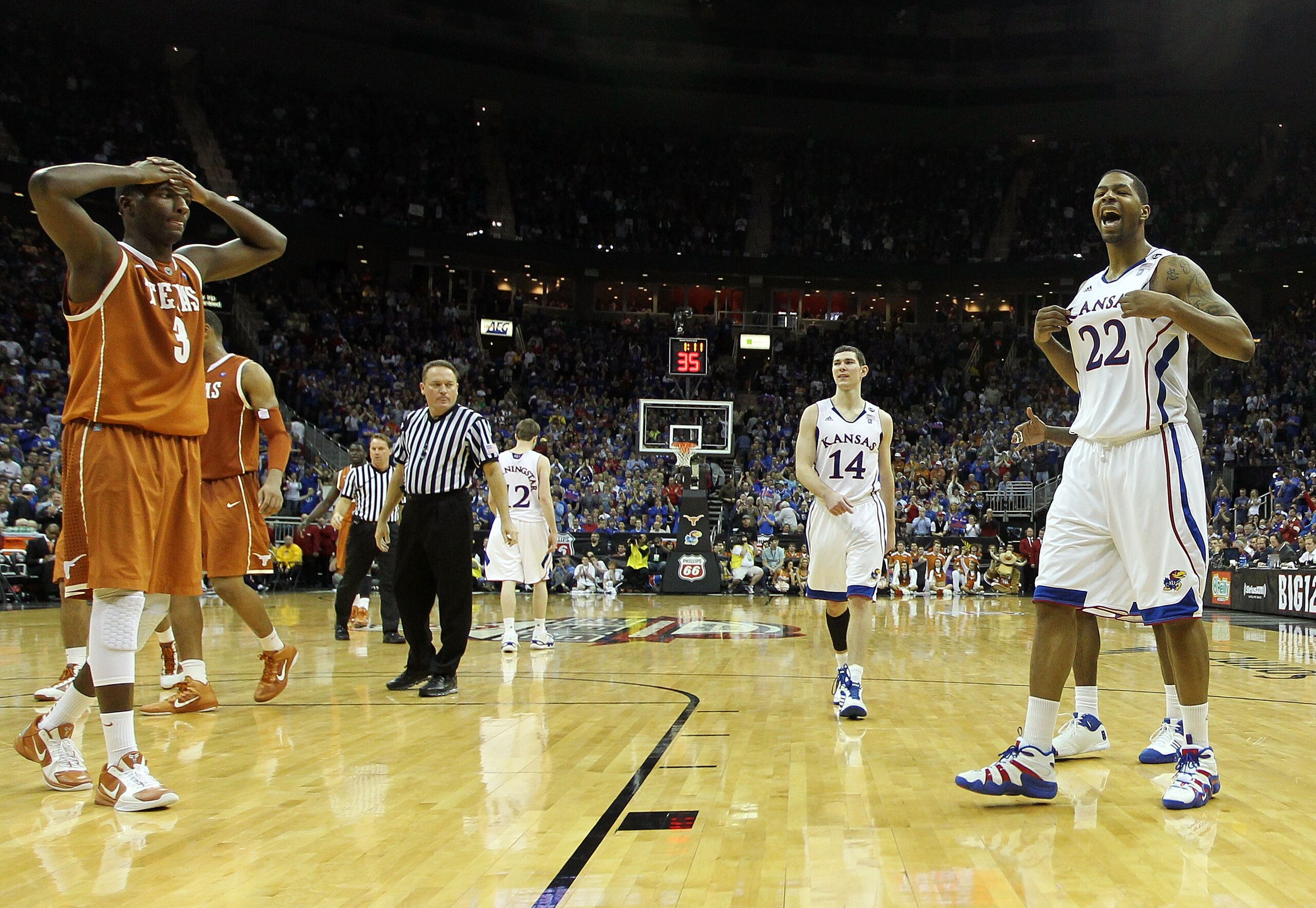 KANSAS CITY, MO - MARCH 12:  Marcus Morris #22 of the Kansas Jayhawks reacts to a play against the Texas Longhorns in the second half of the 2011 Phillips 66 Big 12 Men's Basketball Tournament championship game against the Kansas Jayhawks at Sprint Center