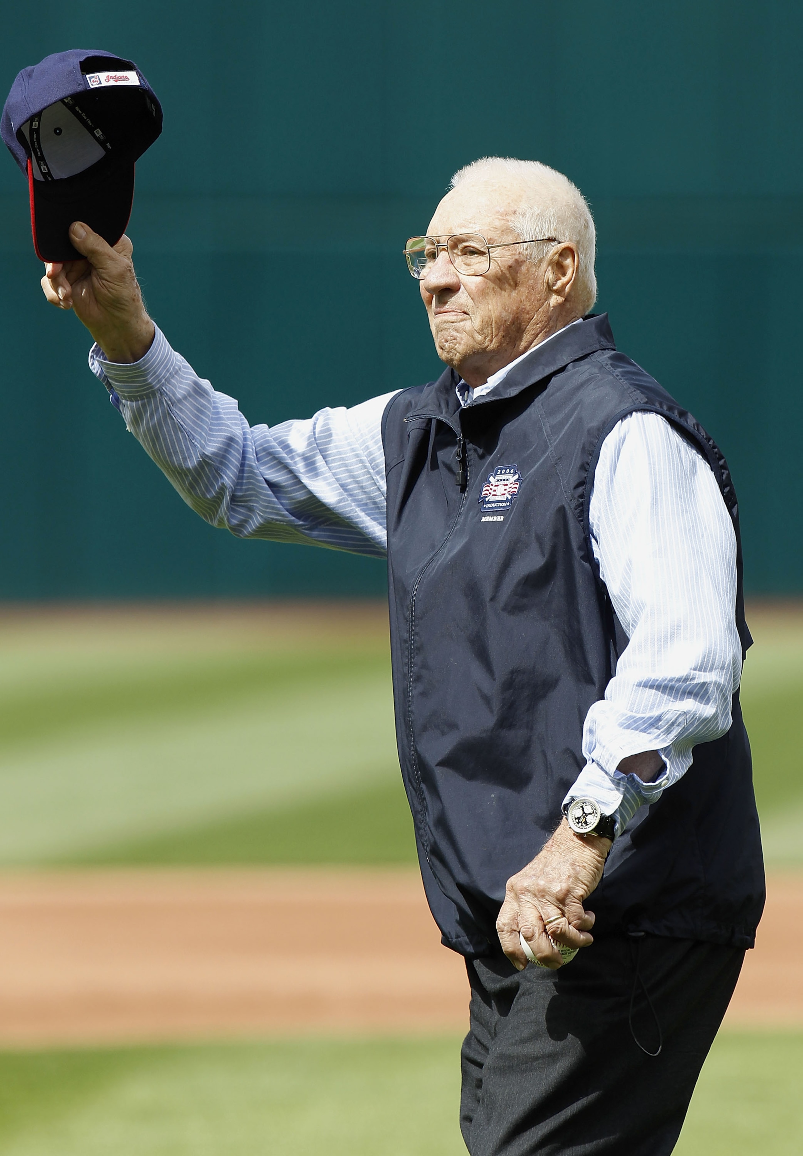 CLEVELAND, OH - APRIL 12:  Hall of Fame Cleveland Indian pitcher Bob Feller tips his cap to fans prior to the Cleveland Indians playing the Texas Rangers duirng Opening Day on April 12, 2010 at Progressive Field in Cleveland, Ohio.  (Photo by Gregory Sham